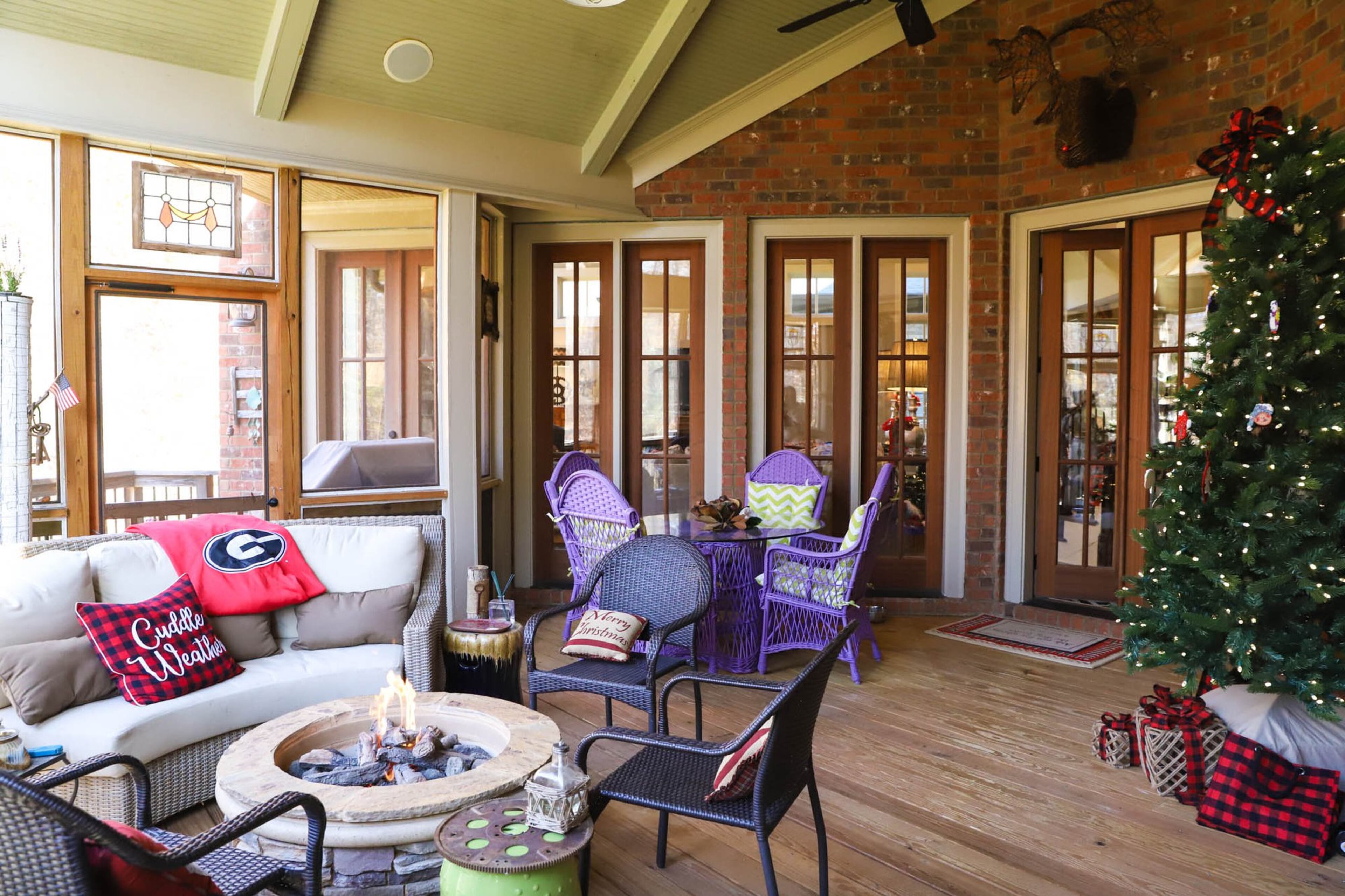 Susan and Dan Graveline’s screened-in porch has several doors that lead into their home, so that the deck is accessible and visible from many angles. That’s part of why they decided to put their Christmas tree on the porch this year. Text by Shannon Dominy. Photo by Reynolds Rogers.