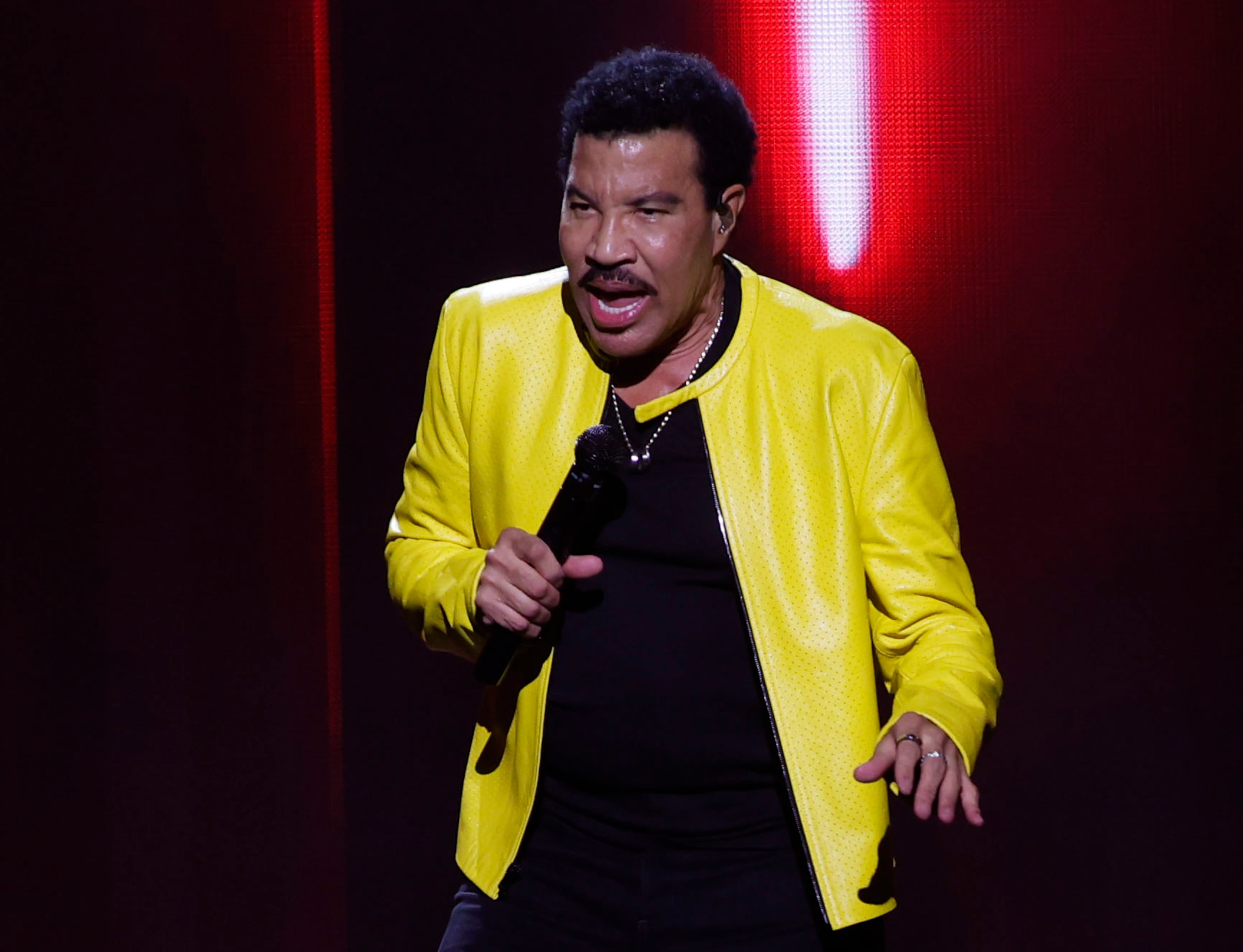 Lionel Richie performs at State Farm Arena on Sunday, July 19, 2026, in a joint concert with Earth, Wind & Fire. Richie started his show singing iconic hits "Hello," "Running with the Night" and "Easy." (Akili-Casundria Ramsess for the AJC)