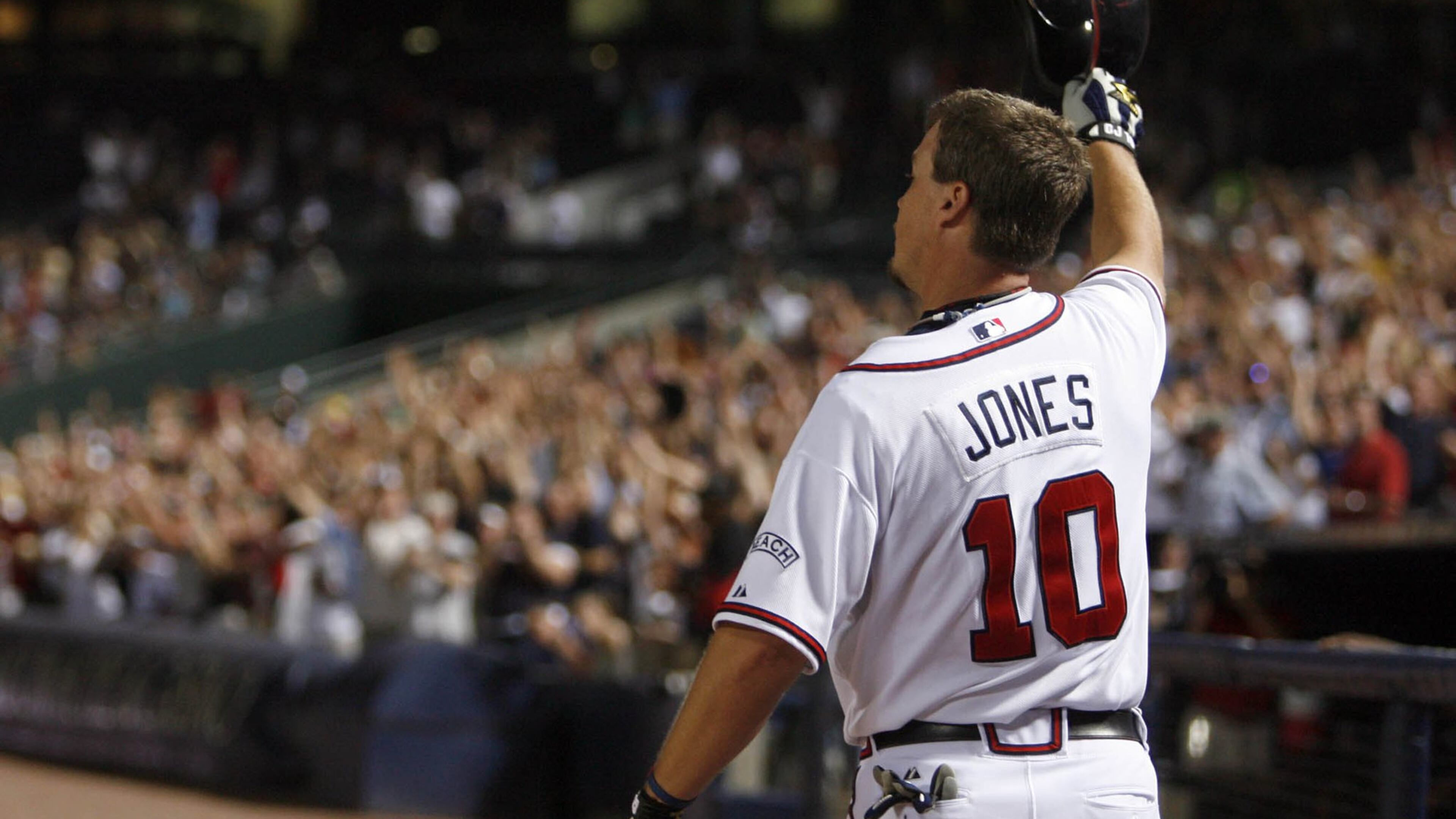 Retired Braves third baseman Chipper Jones, here tipping his cap to the crowd after hitting the 400th home run of his career in 2008, will return to the team as a special assistant to baseball operations. (Jason Getz / AJC )