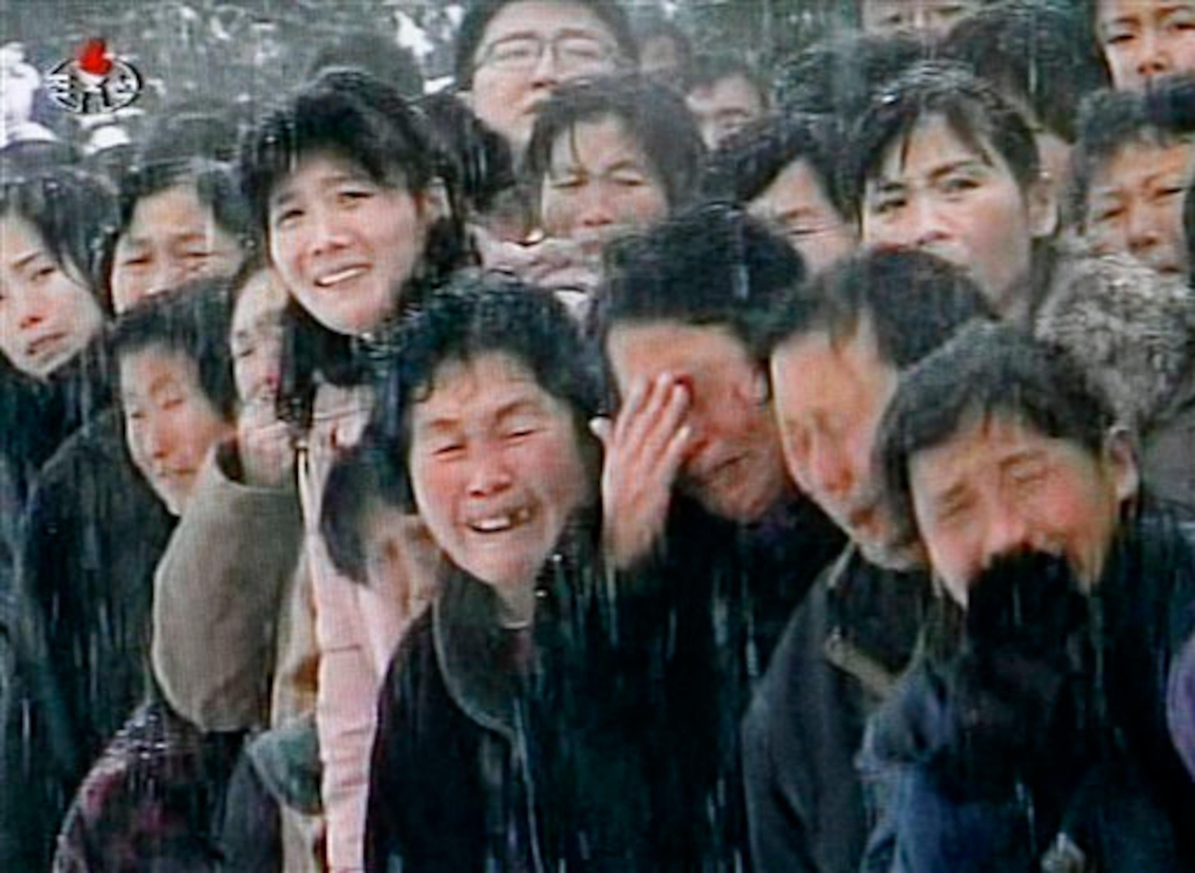 In this image made from KRT video, mourners cry during a funeral procession for late North Korean leader Kim Jong Il in snowy Pyongyang, North Korea, Wednesday, Dec. 28, 2011. (AP Photo/KRT via APTN)