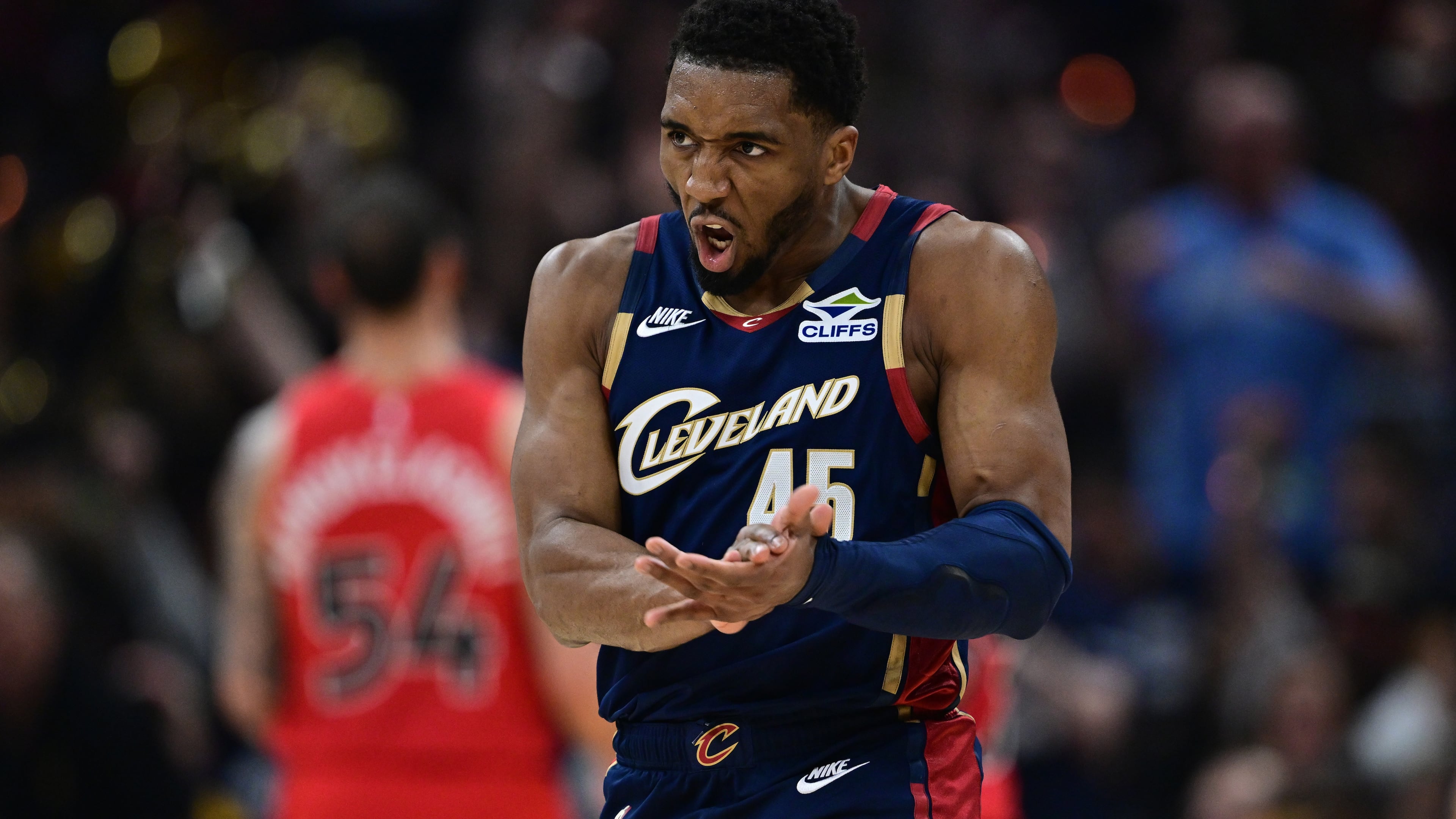 Cleveland Cavaliers guard Donovan Mitchell reacts after an assist during the first half in Game 1 of a first-round NBA playoffs basketball series against the Toronto Raptors, Saturday, April 18, 2026, In Cleveland. (AP Photo/David Dermer)