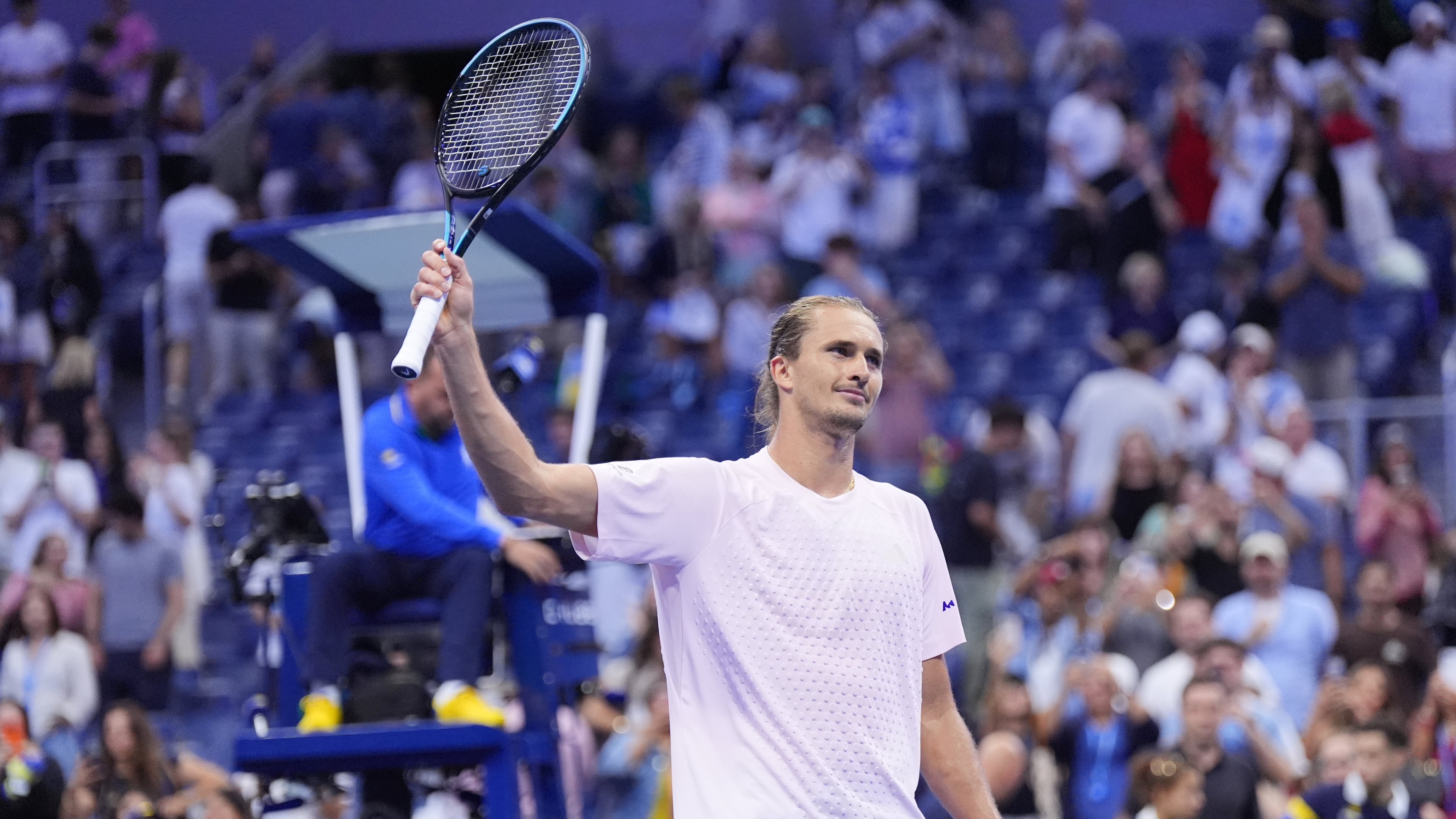 Alexander Zverev, of Germany, acknowledges fans after defeating Lorenzo Sonego, of Italy, in five sets in the first round of the U.S. Open tennis championships early Wednesday, Sept. 2, 2026, in New York. (AP Photo/Frank Franklin II)