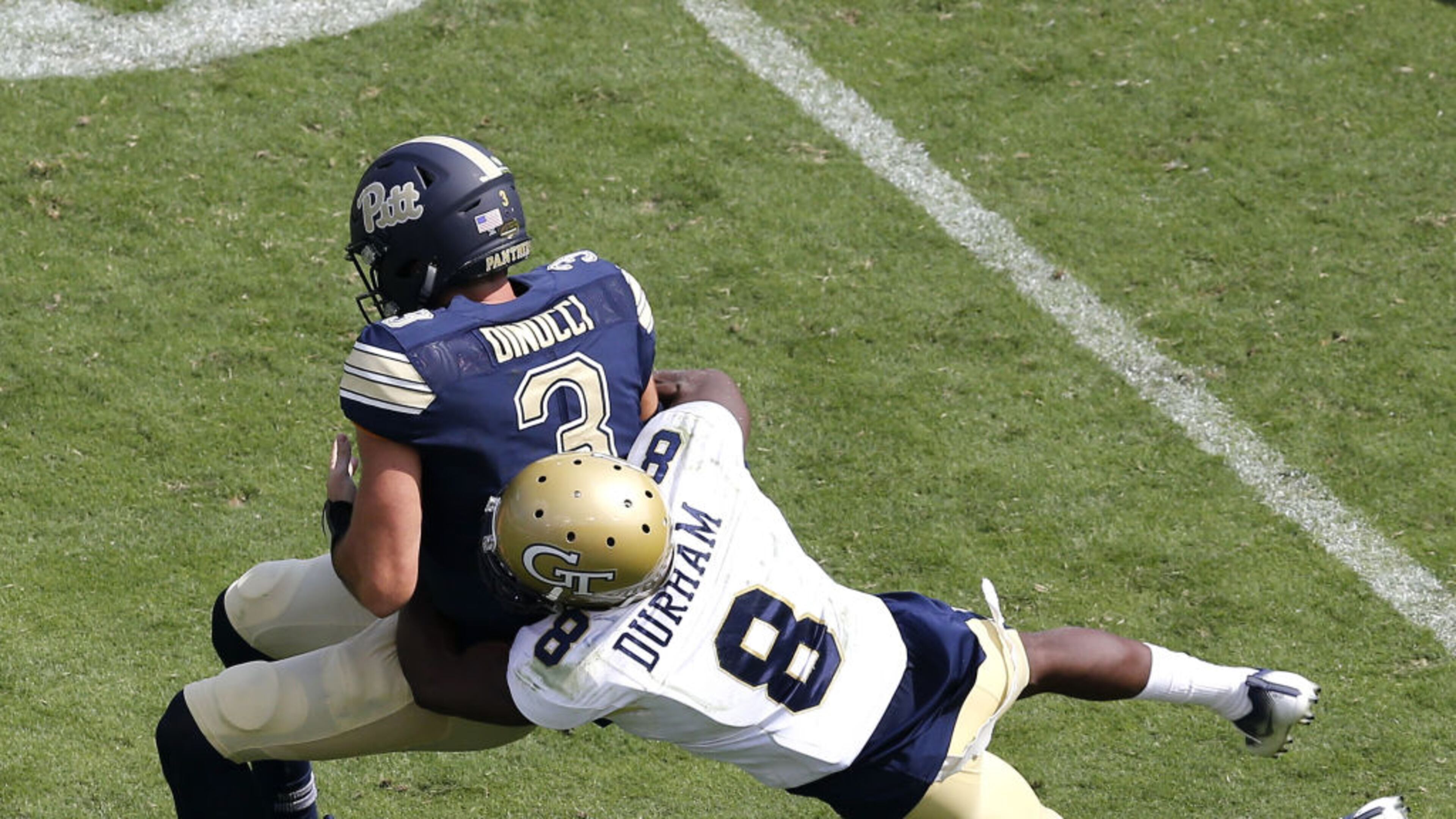 Cornerback Step Durham of the Georgia Tech Yellow Jackets tackles quarterback Ben Dinucci of the Pittsburgh Panthers during the game at Bobby Dodd Stadium on September 23, 2017 in Atlanta, Georgia. (Photo by Mike Zarrilli/Getty Images)