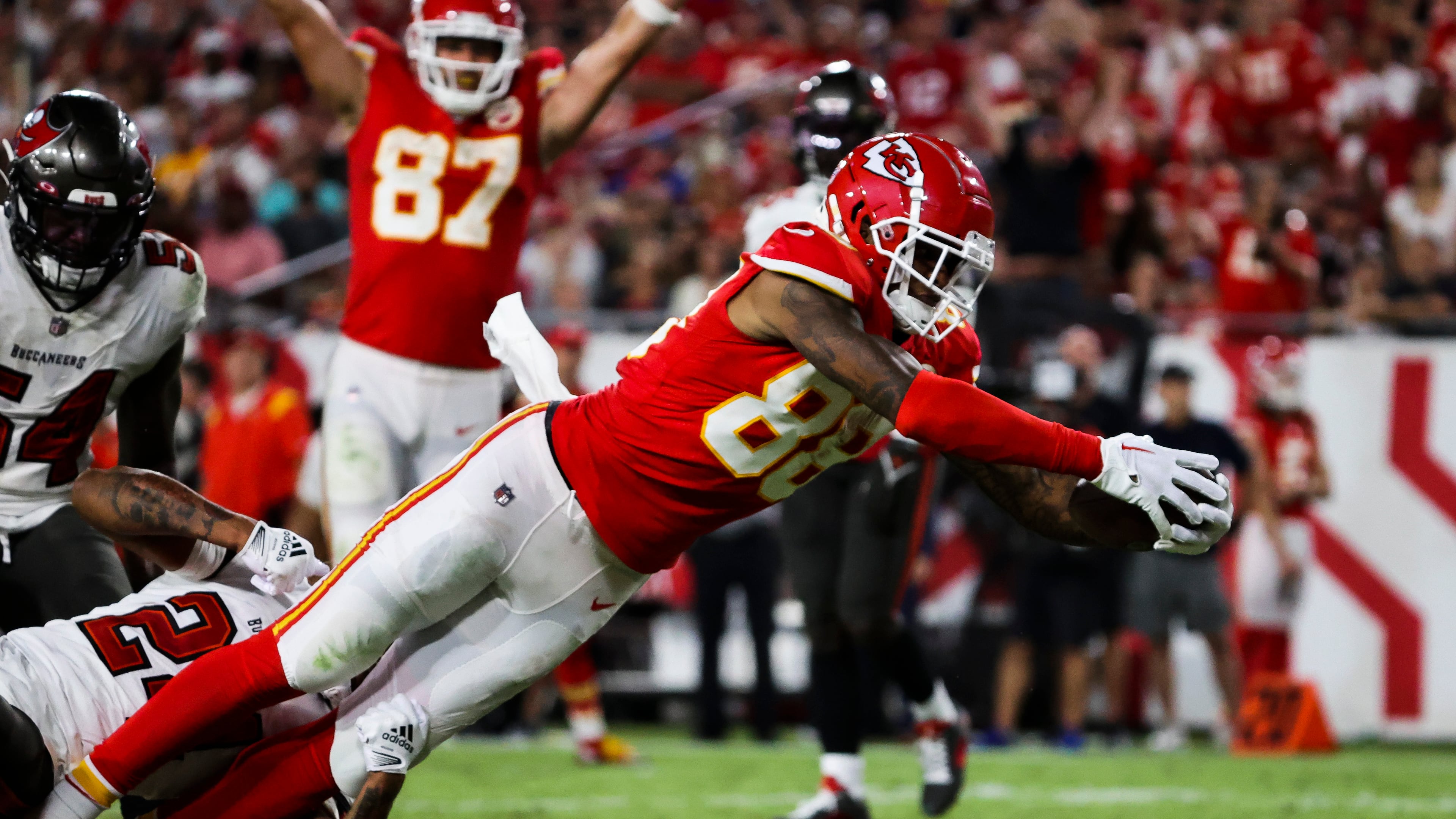 Kansas City Chiefs tight end Jody Fortson (88) scores a touchdown on a 10-yard pass from Patrick Mahomes (15) as he gets by Tampa Bay Buccaneers cornerback Carlton Davis III (24) during third-quarter action at Raymond James Stadium on Sunday, Oct. 2, 2022, in Tampa. (Dirk Shadd/Tampa Bay Times/TNS)