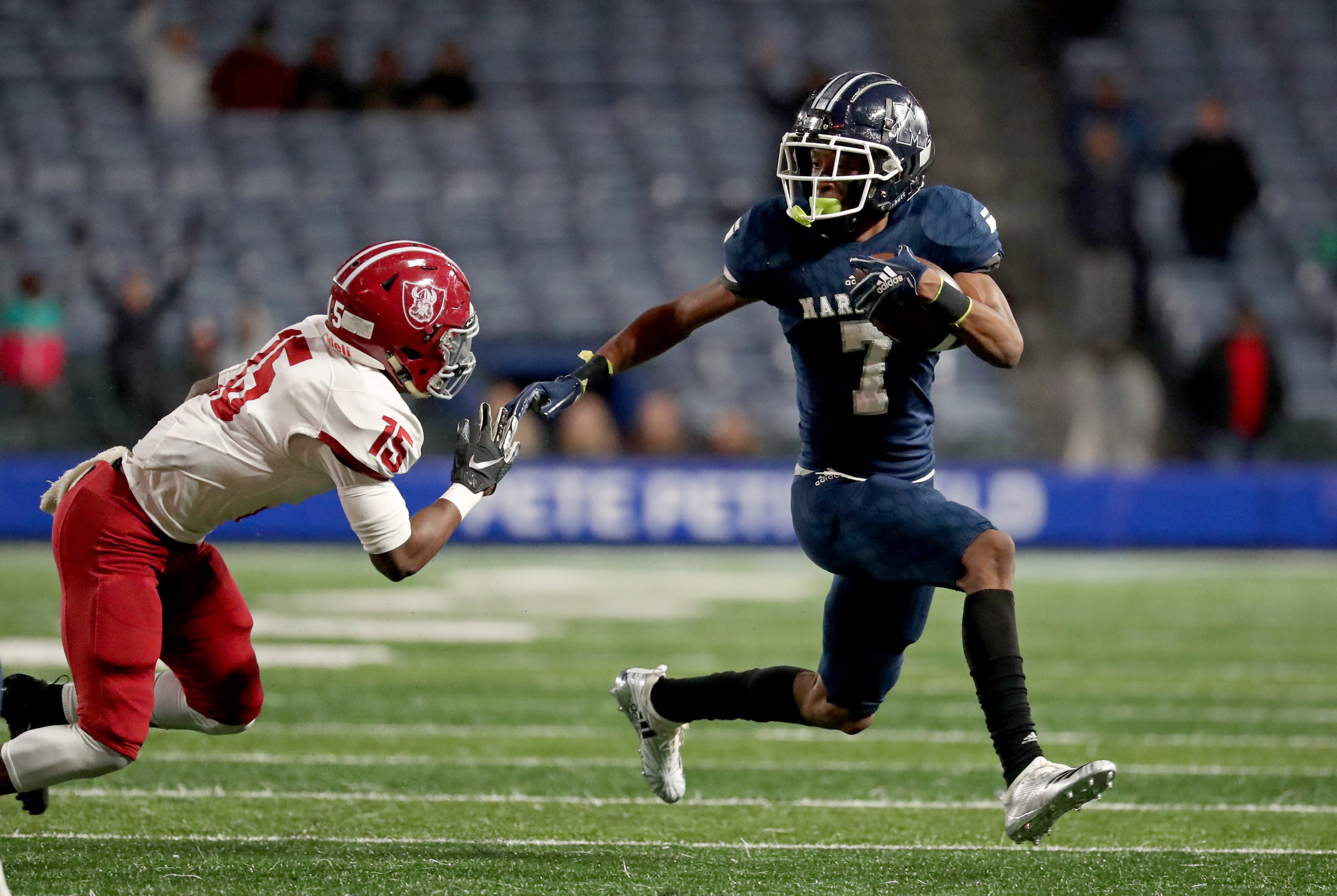 Marietta wide receiver Ricky White (7) makes a move on Lowndes defensive back Tylar Belcher (15) in the first half of the Class AAAAAAA high school football state title game at Georgia State Stadium Saturday, December 14, 2019 in Atlanta. (JASON GETZ/SPECIAL TO THE AJC)