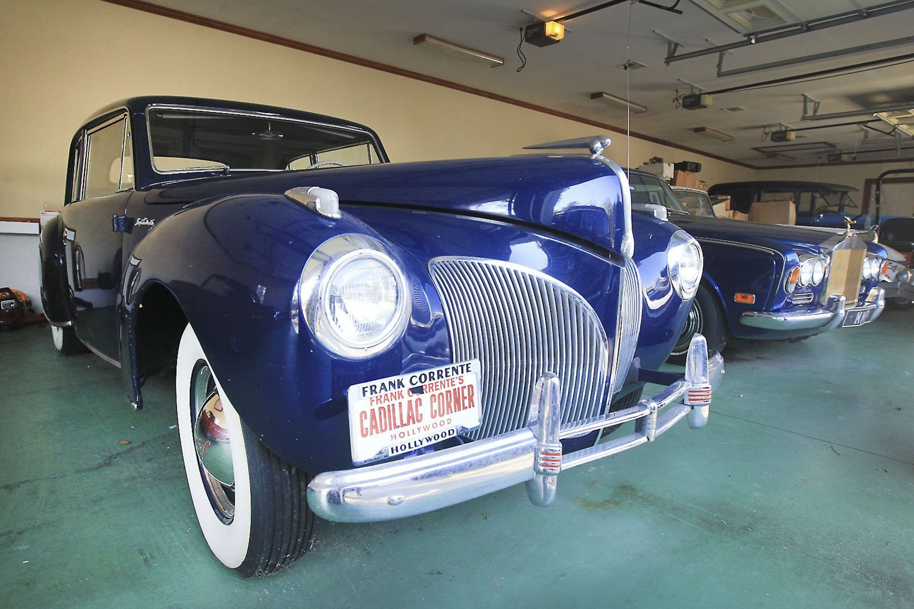A 1941 Lincoln sits in the multi-car garage of James Brown's Beech Island, S.C., mansion estate. Russell Bauknight, the estate's fiduciary, and David Washington, the mansion's groundskeeper, work to keep the house and its contents secure.