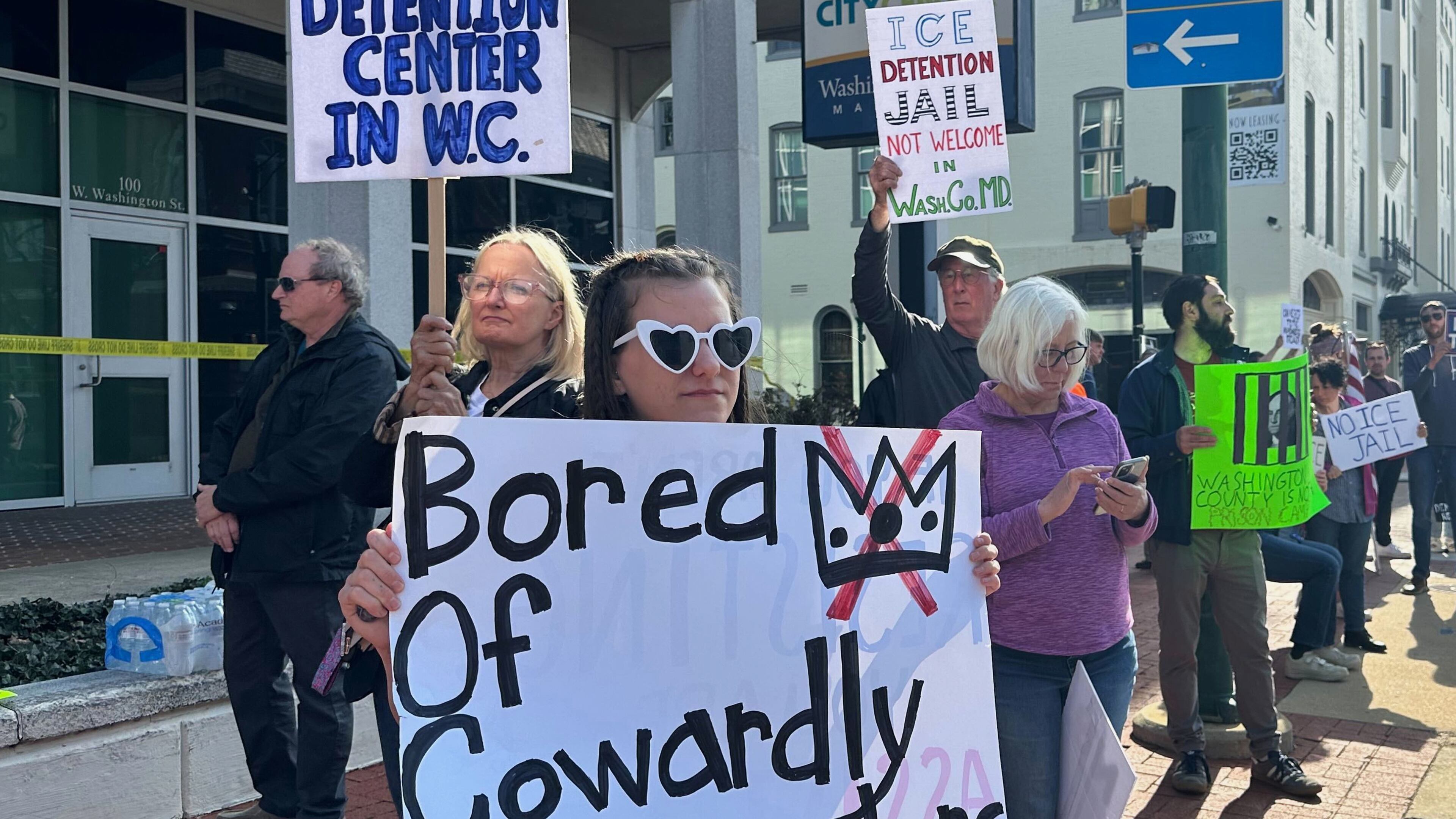 Protesters rally against a planned immigration detention facility outside a Washington County Commission meeting in Hagerstown, Md., Tuesday, March 31, 2026. (AP Photo/Nathan Ellgren)