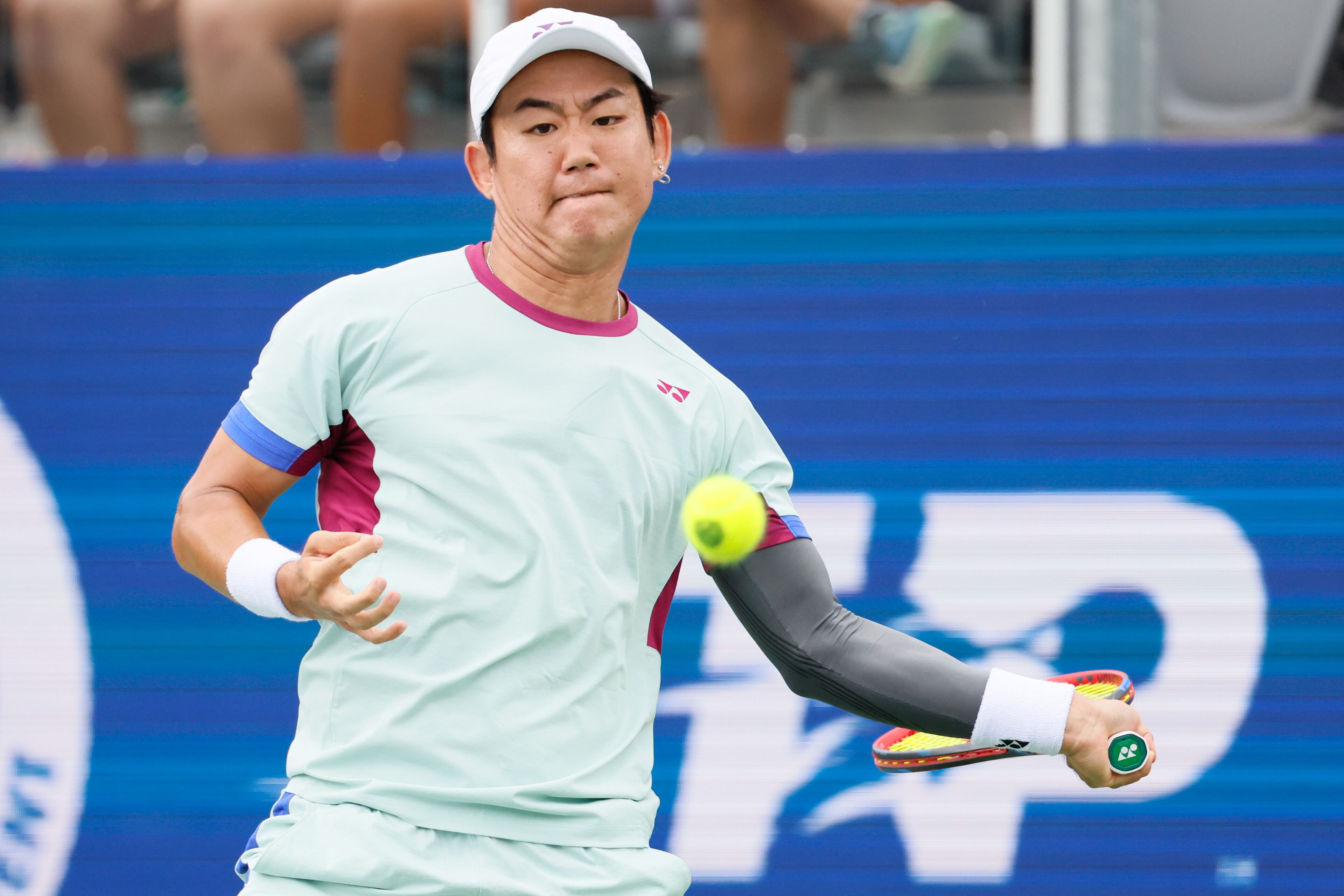 Japan’s Yoshihito Nishioka keeps an eye on the ball as he prepares a forehand during a final match at the 2024 Atlanta Tennis Open at Atlantic Station on Sunday, July 28, 2024, in Atlanta.
(Miguel Martinez / AJC)