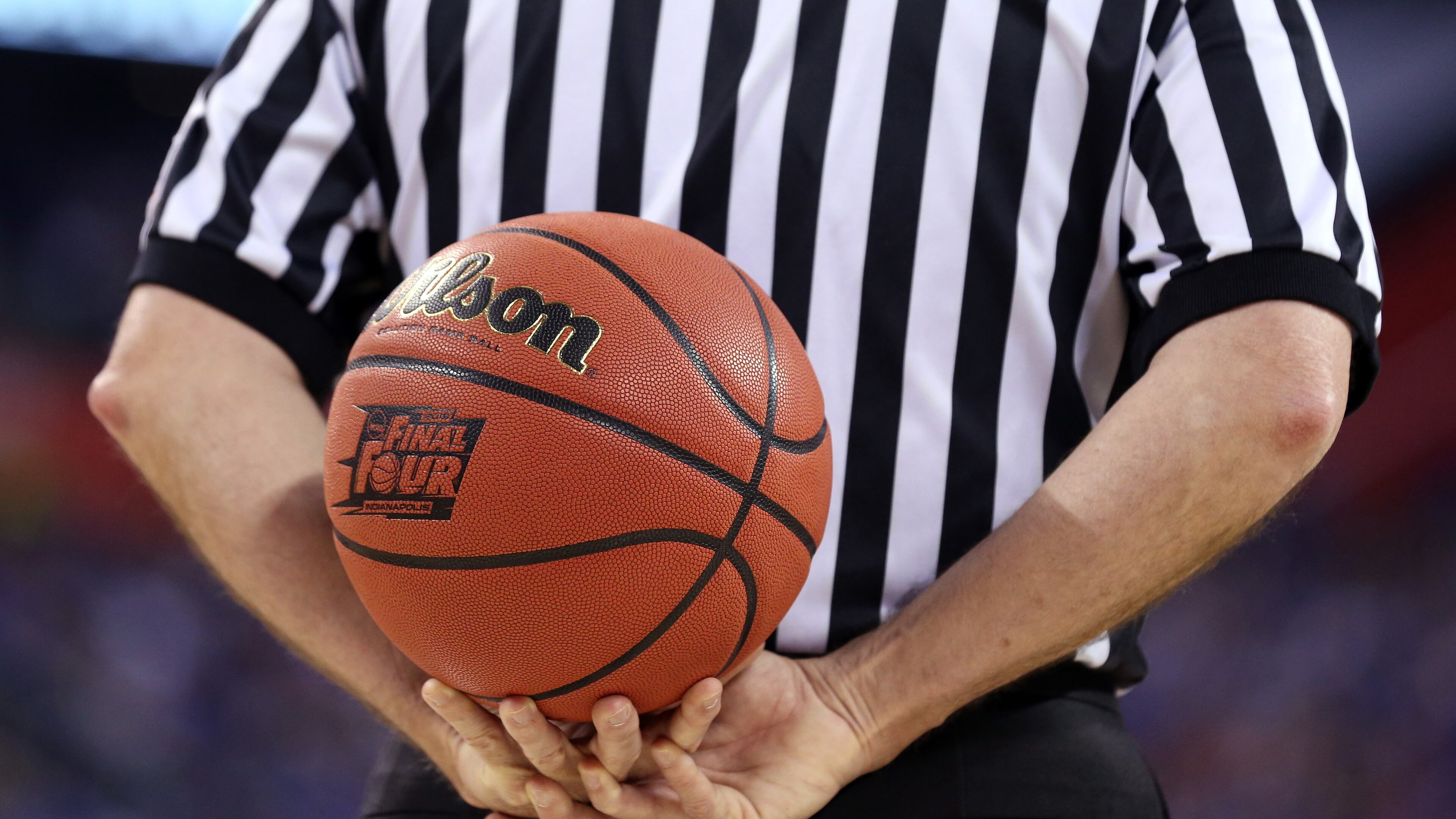 INDIANAPOLIS, IN - APRIL 04: An official holds the game ball as the Duke Blue Devils and the Michigan State Spartans prepare to play during the NCAA Men's Final Four Semifinal at Lucas Oil Stadium on April 4, 2015 in Indianapolis, Indiana. (Photo by Streeter Lecka/Getty Images)