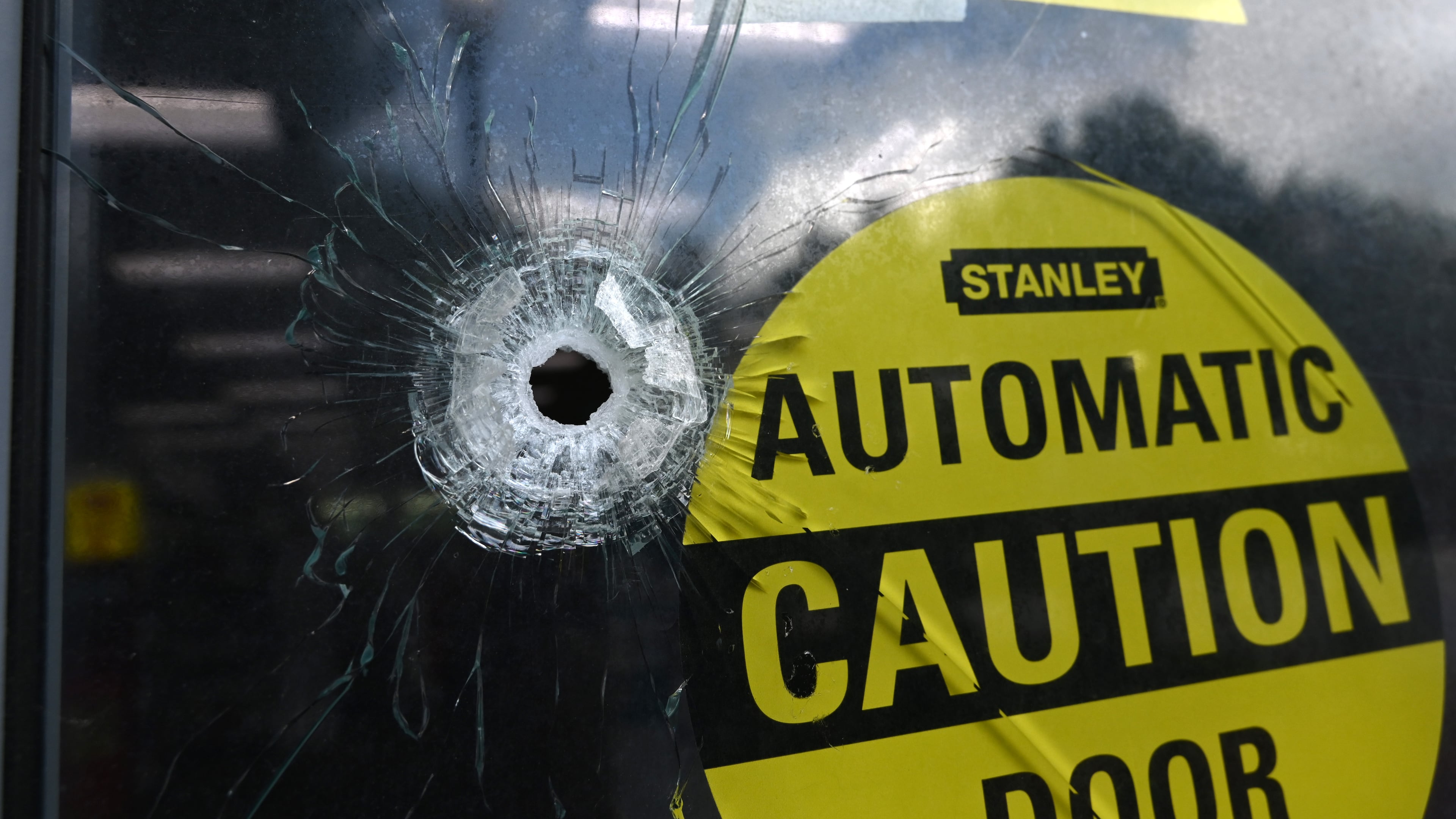 Bullet holes are visible at the Emory Point CVS on Saturday, August 9, 2025, after a deadly shooting Friday. A man opened fire on the Centers for Disease Control and Prevention on Friday, killing a police officer who tried to stop him, authorities said. (Hyosub Shin/AJC)