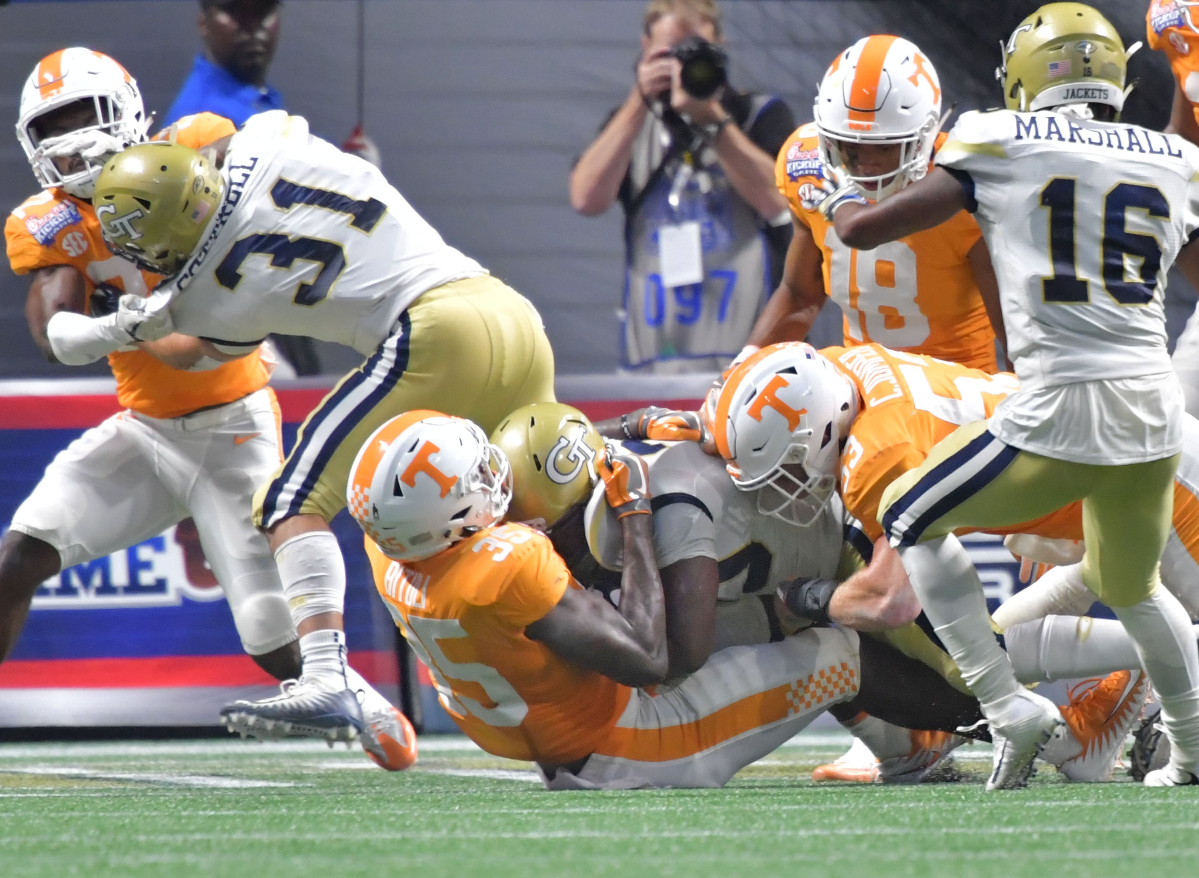 Georgia Tech running back KirVonte Benson (30) jumps over Tennessee linebacker Daniel Bituli (35) for a touchdown in the first half of NCAA college football game at the Mercedes-Benz Stadium on Monday, September 4, 2017. HYOSUB SHIN / HSHIN@AJC.COM