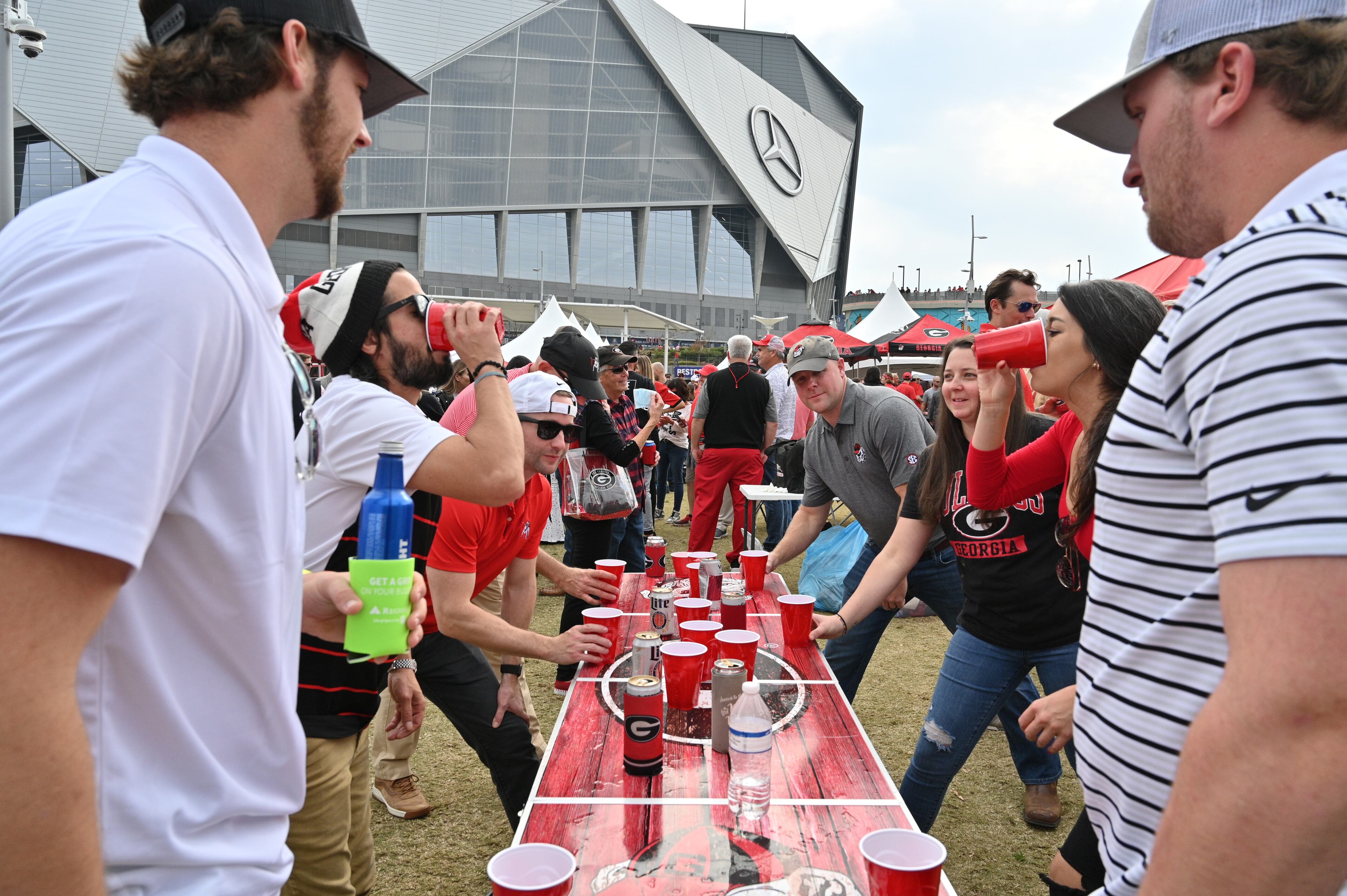 Georgia fans enjoy tailgating at The Home Depot Backyard prior to the SEC Championship game between Georgia and Alabama on Saturday, December 4, 2021. (Hyosub Shin / Hyosub.Shin@ajc.com)