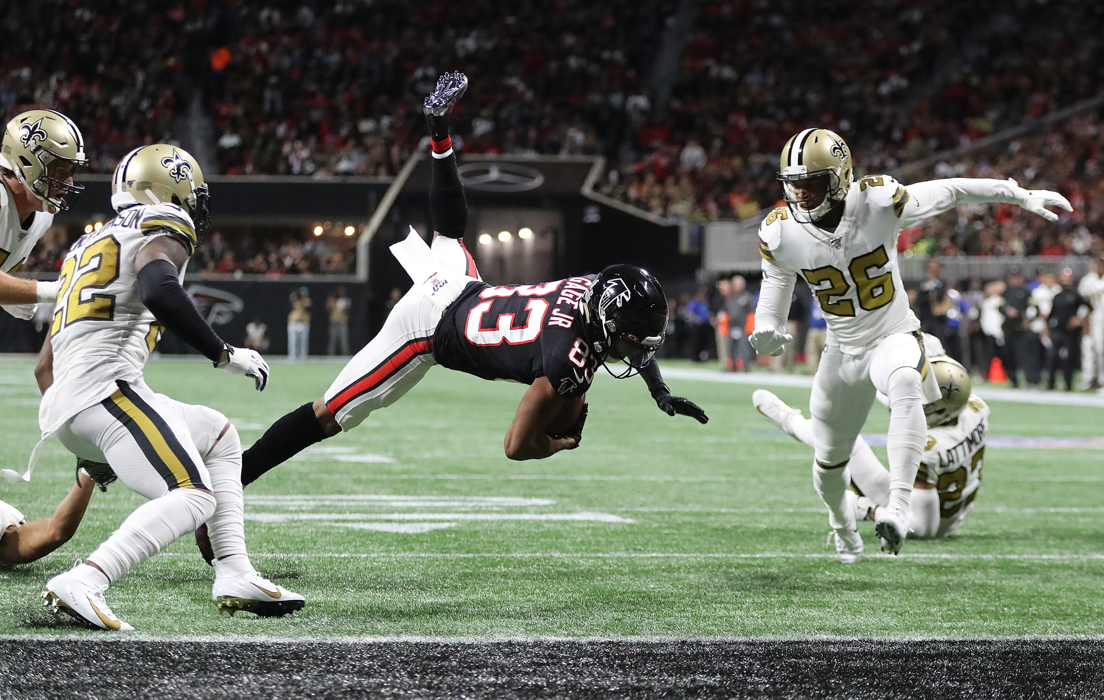 Falcons wide receiver Russell Gage makes a catch just short of the end zone between New Orleans Saints defenders Thursday, Nov. 28, 2019, at Mercedes-Benz Stadium in Atlanta.