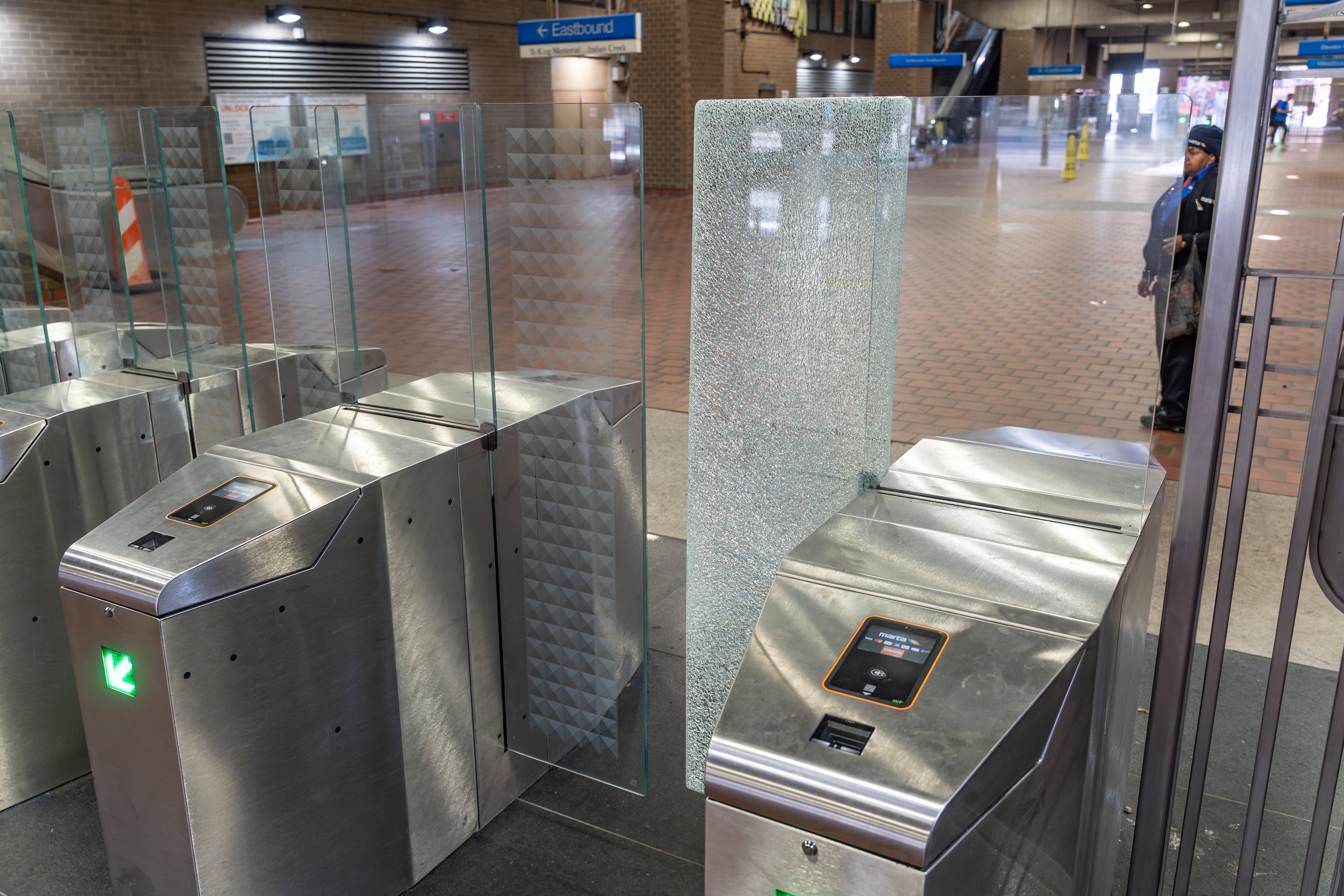 Shattered glass is seen at a broken faregate at the Georgia State MARTA station on Tuesday, June 2, 2026. (Ben Hendren for the AJC)