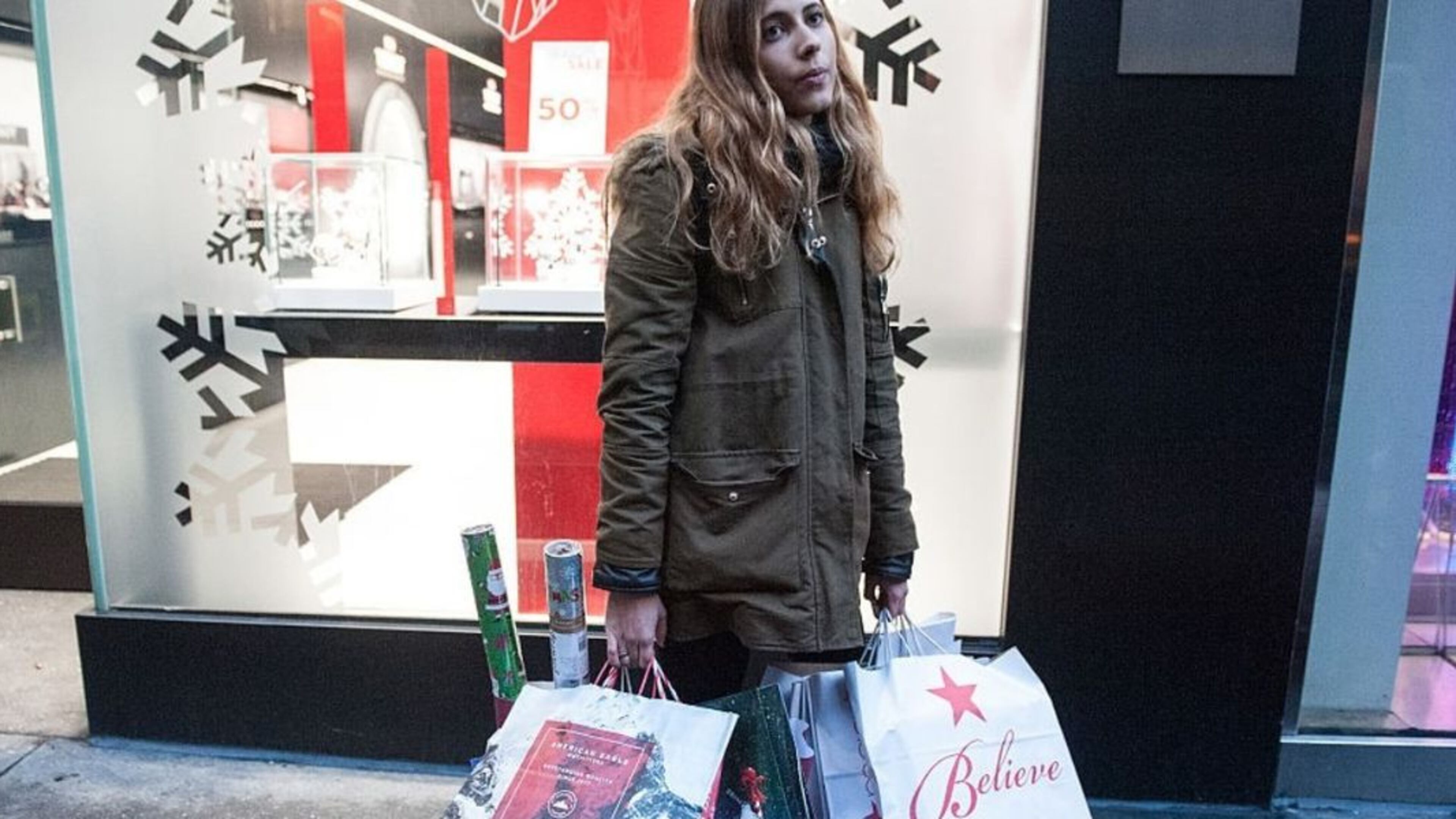 NEW YORK, NY - DECEMBER 24, 2016 : A shopper holds a number of gift bags along Fifth Ave. on December 24, 2016 in New York City. Last-minute shoppers hit the stores the day before Christmas. Photo by Stephanie Keith/Getty Images (Photo by Stephanie Keith/Getty Images)