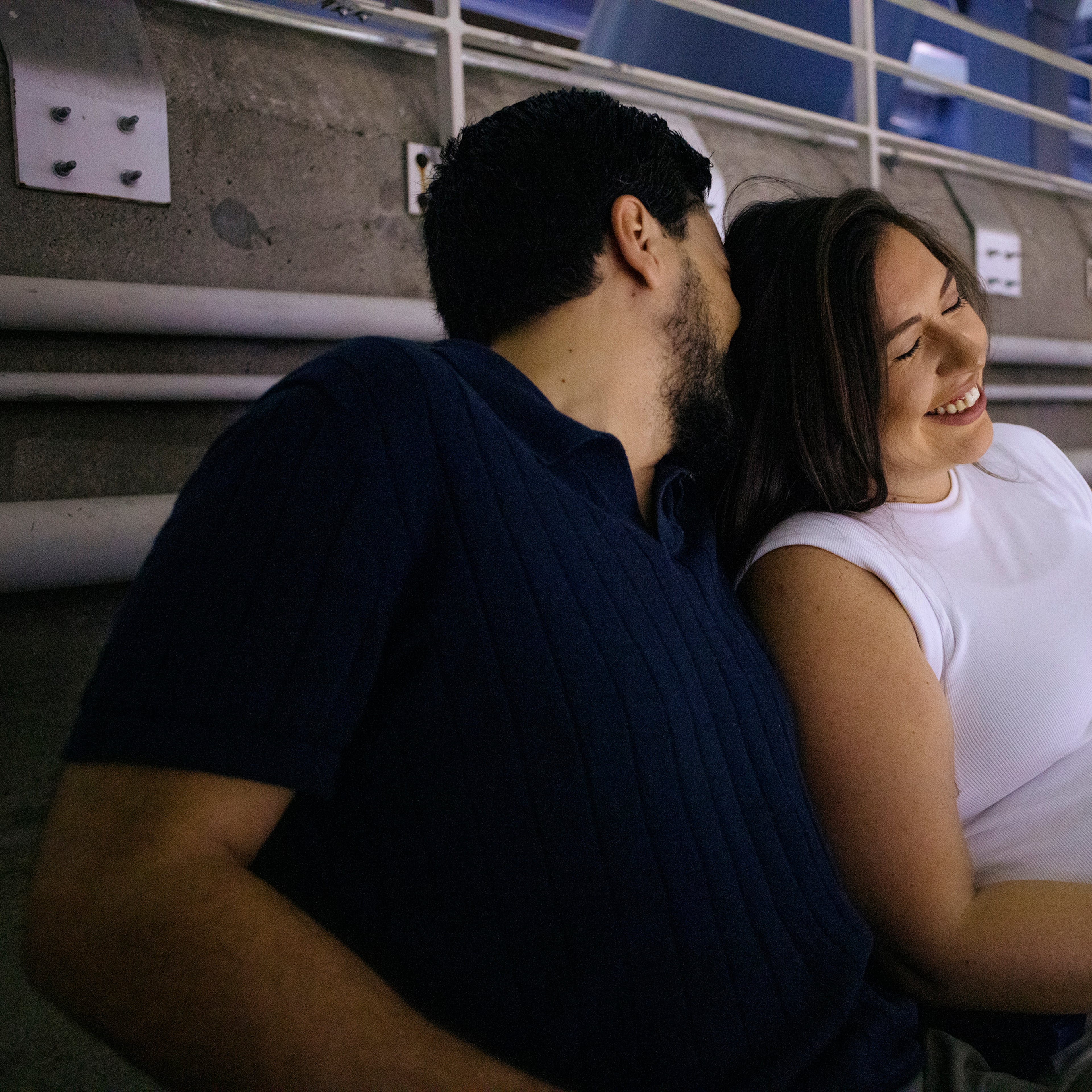 Matthew Shalhoub, left, and Jennifer Shalhoub sit in Row Z a couple days before their babyÕs due date, during the U.S. Open tennis tournament, at Arthur Ashe Stadium in Queens, on Aug. 30, 2024. (Jos A. Alvarado Jr./The New York Times)