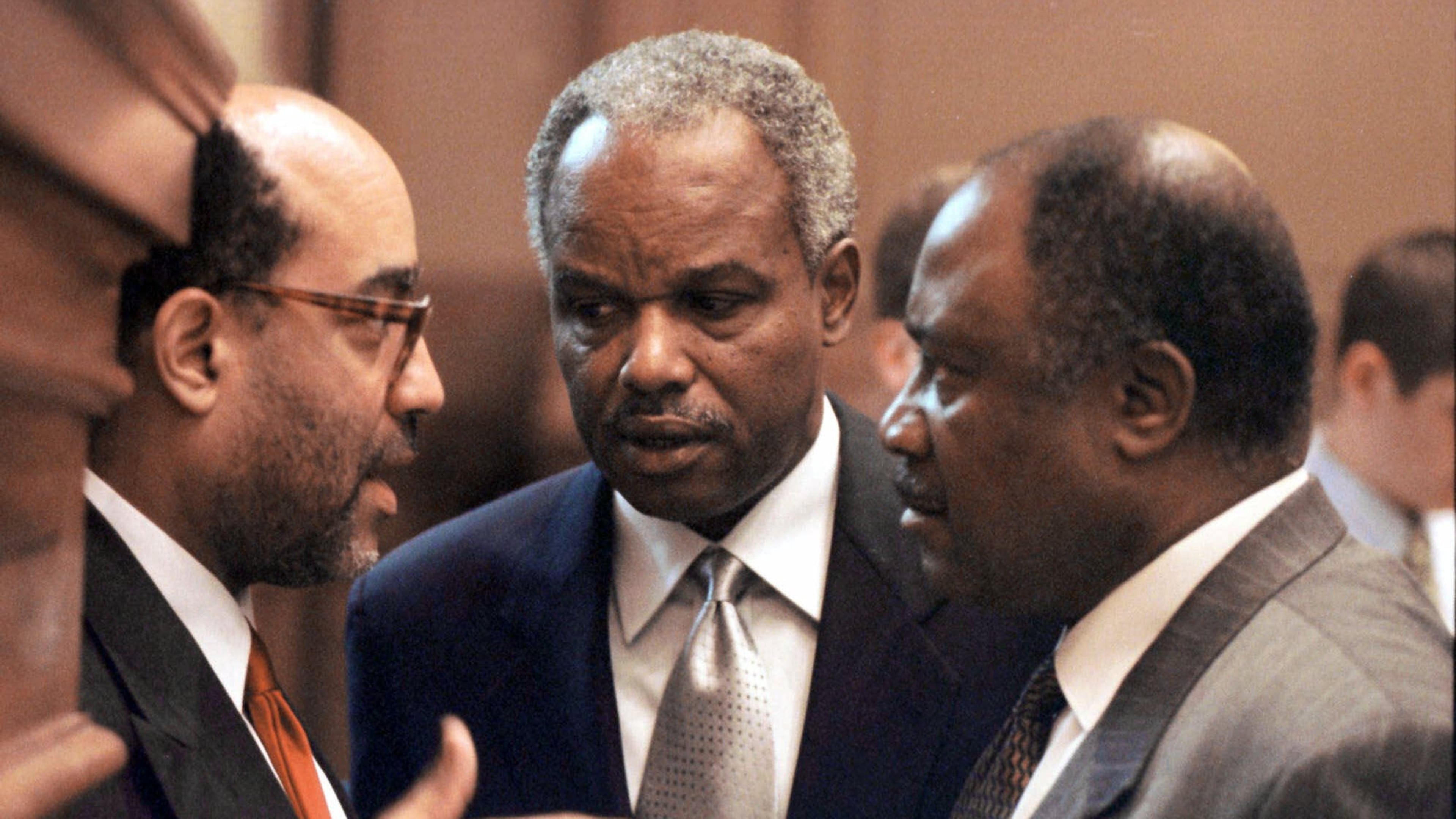Georgia Congressman David Scott (center) confers with fellow lawmakers at the state Capitol in 2000. (Alan Mothner/AP)