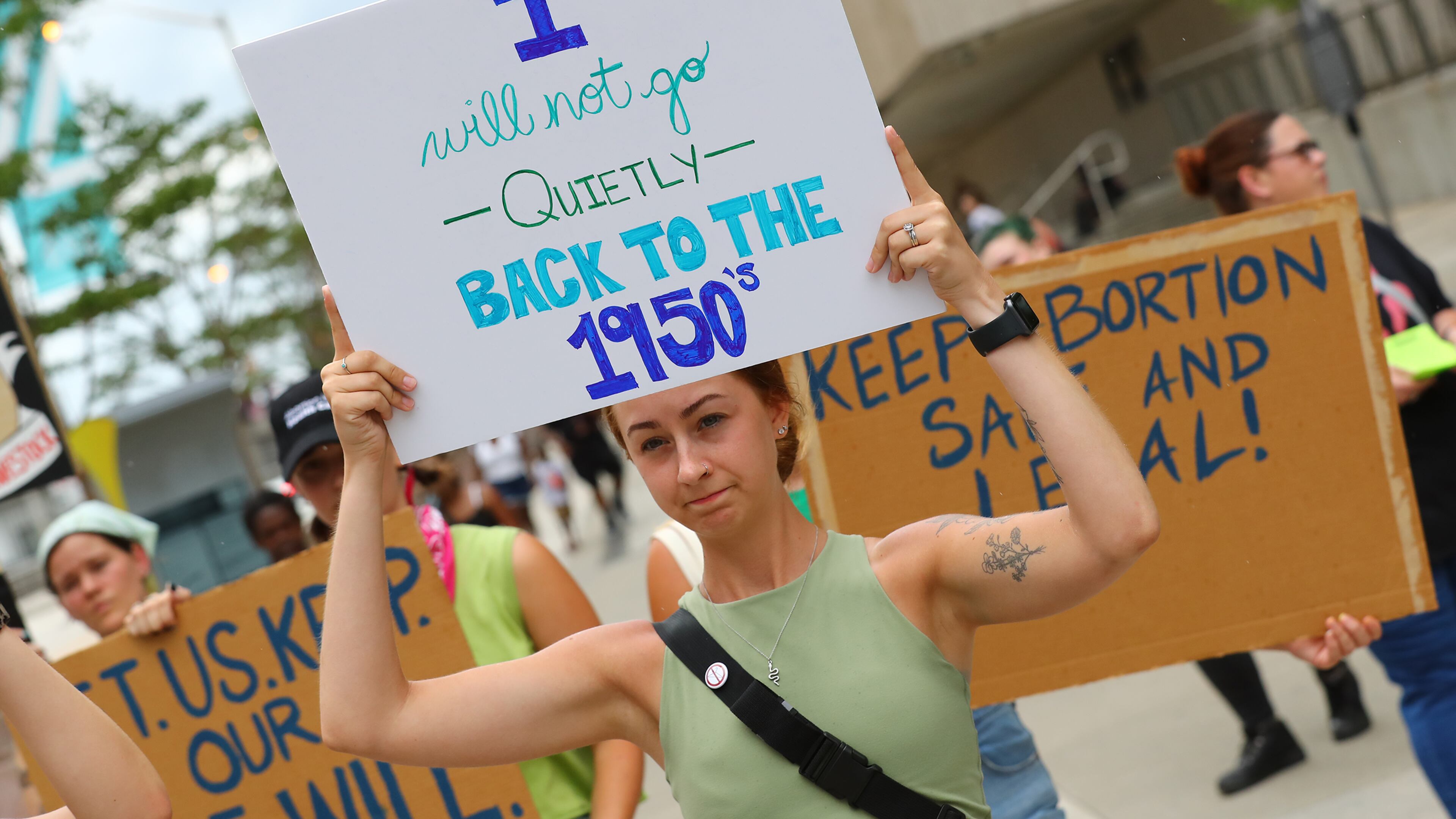 Protesters hold their signs during an abortion rights rally led by members of RiseUp4AbortionRights.org at at CNN Center on Sunday, July 3, 2022, in Atlanta. (Photo: Curtis Compton / Curtis.Compton@ajc.com)