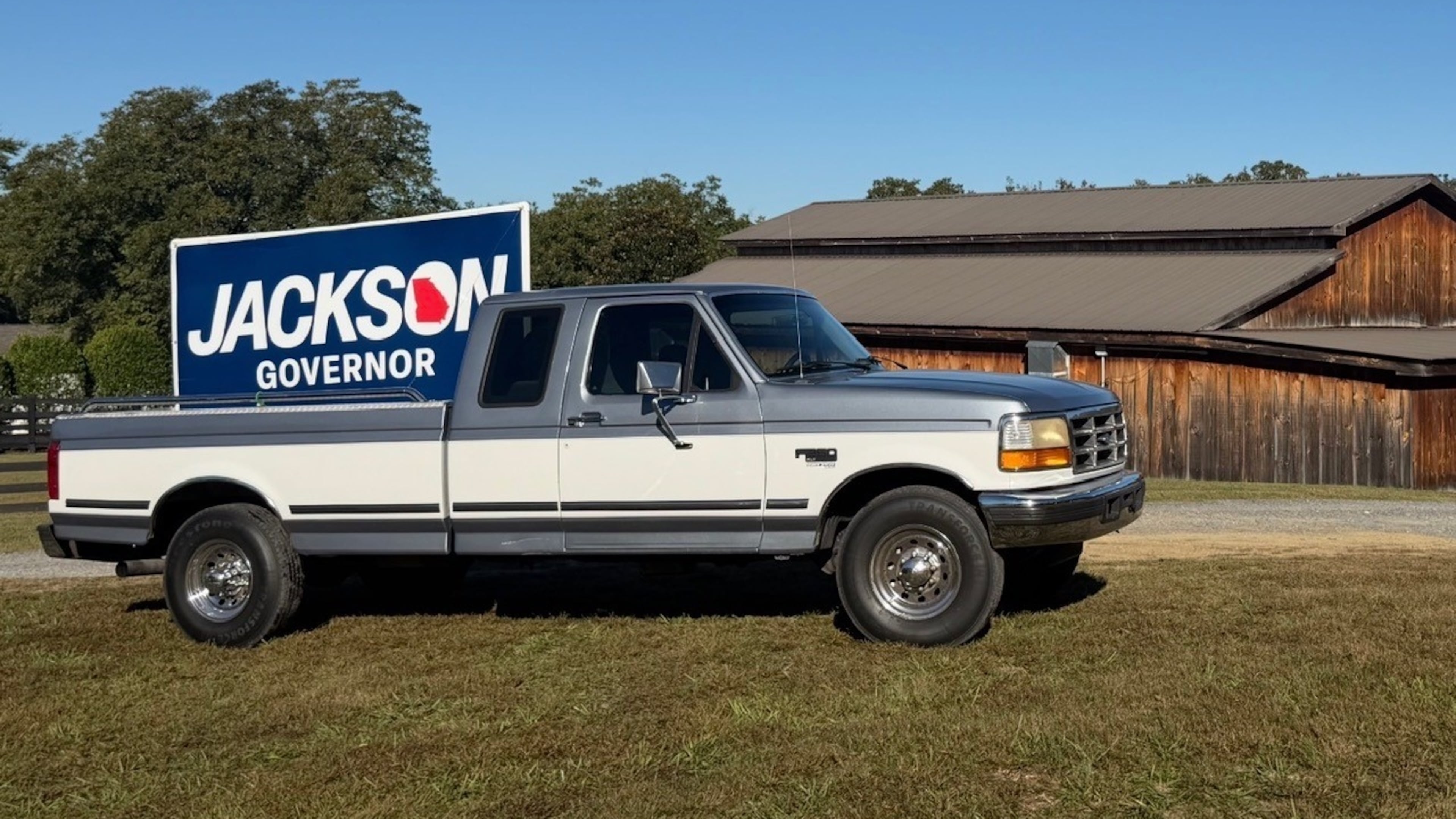 A pickup truck carrying a Rick Jackson campaign sign is seen outside of a campaign event during early voting in Chatsworth on Wednesday. (Patricia Murphy/AJC)