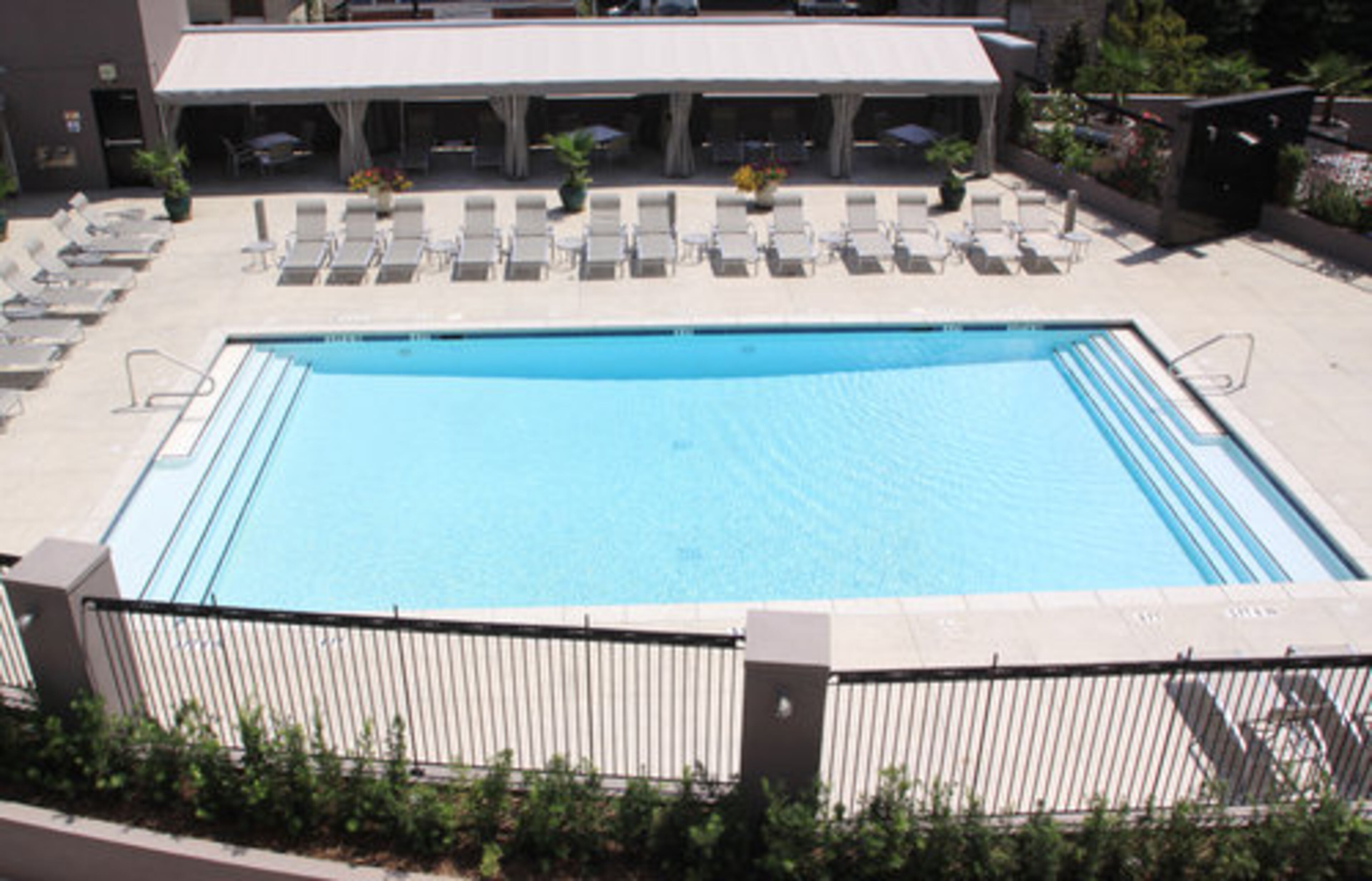 "It's a great central location for having friends over to go out in Midtown," shares Rafshoon whose loft has a bird's-eye view of his condominium's stylish pool and lounge area. "We entertain often, we had neighbors over last weekend. We usually host birthday, New Year's and pool parties," adds Gaul.