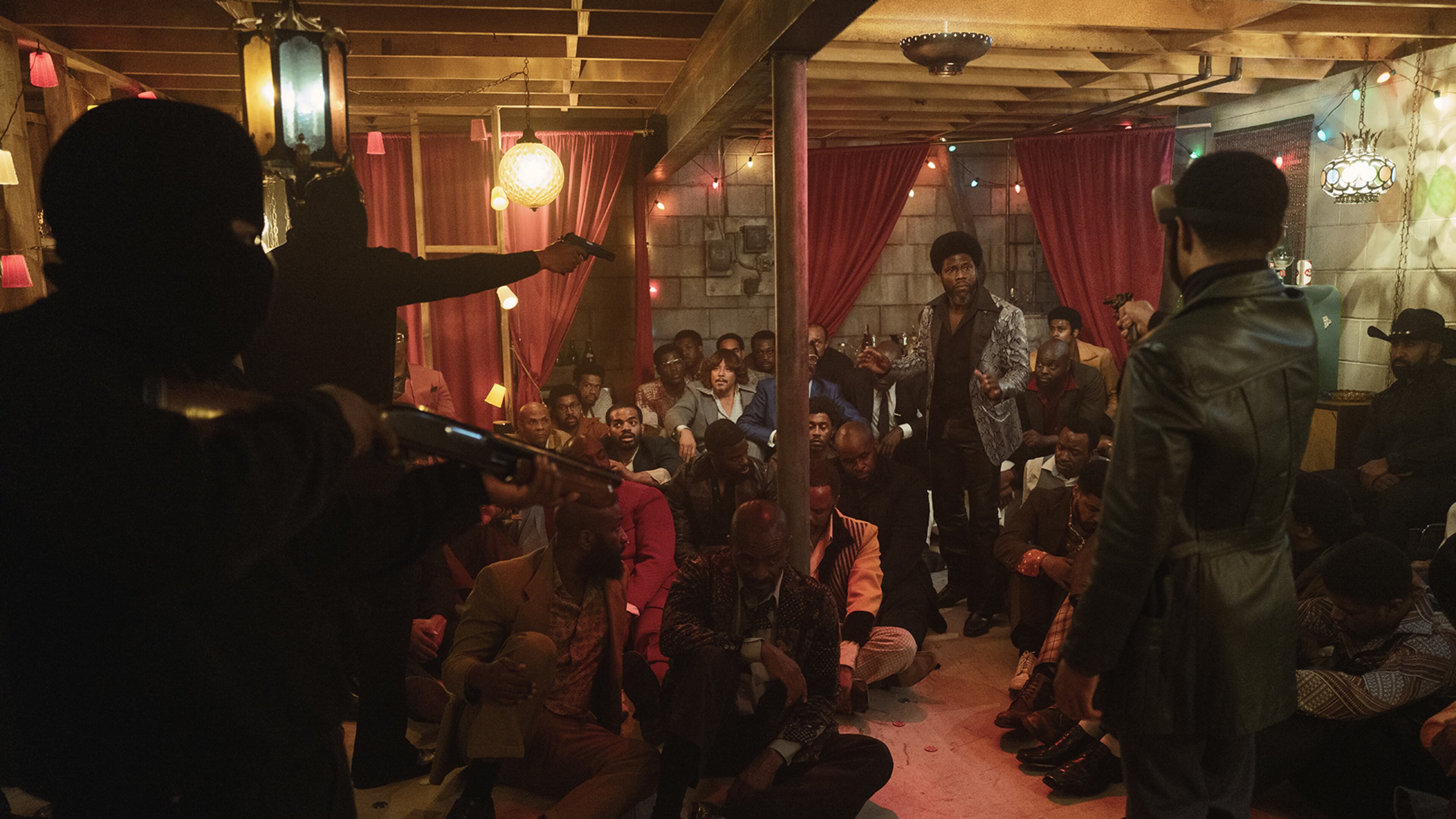 Kevin Hart, right background, as "Chicken Man" in the forthcoming Peacock Series "Fight Night."