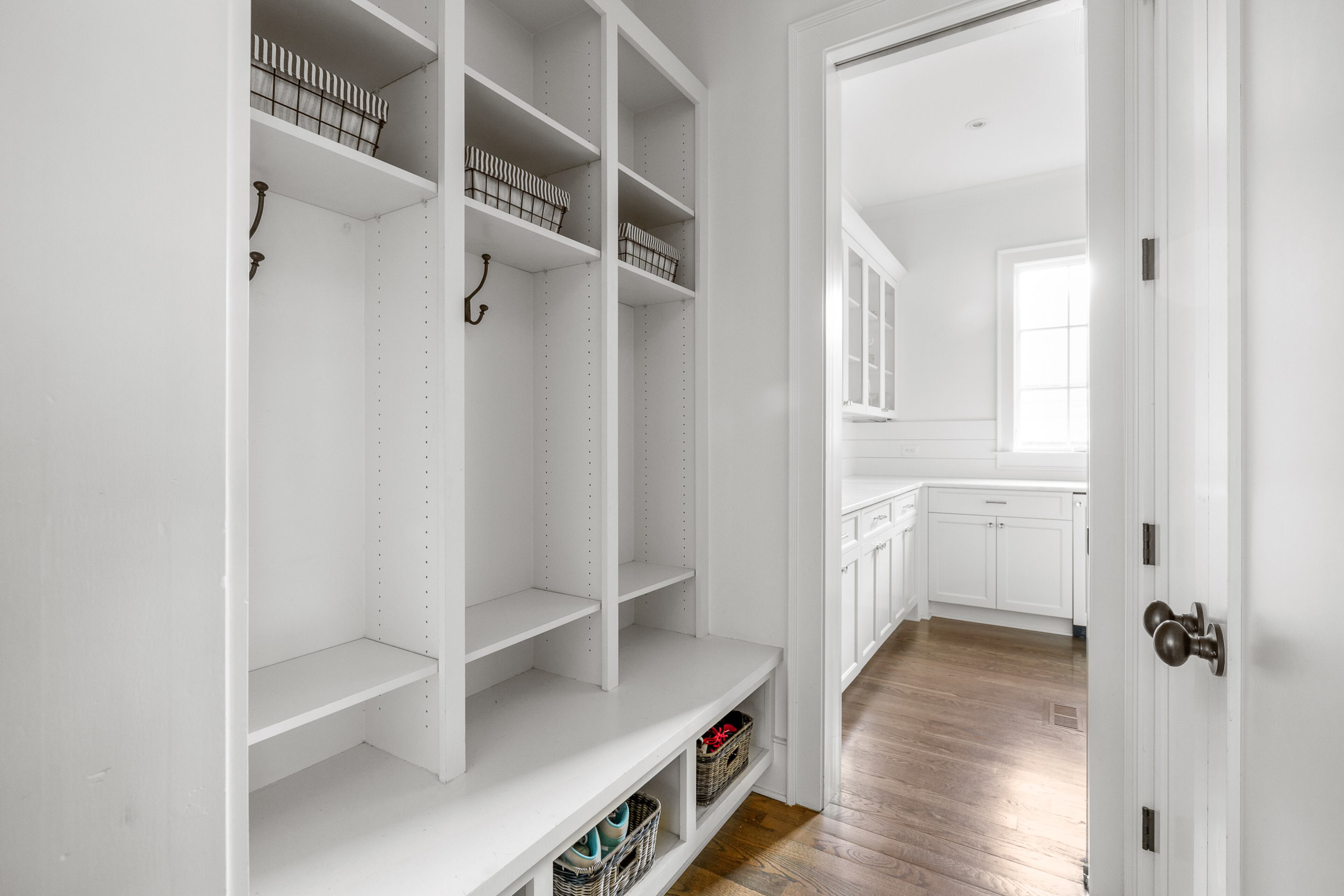 A mudroom allows for coats, shoes and other apparel to be hung up and put away before walking through the home.