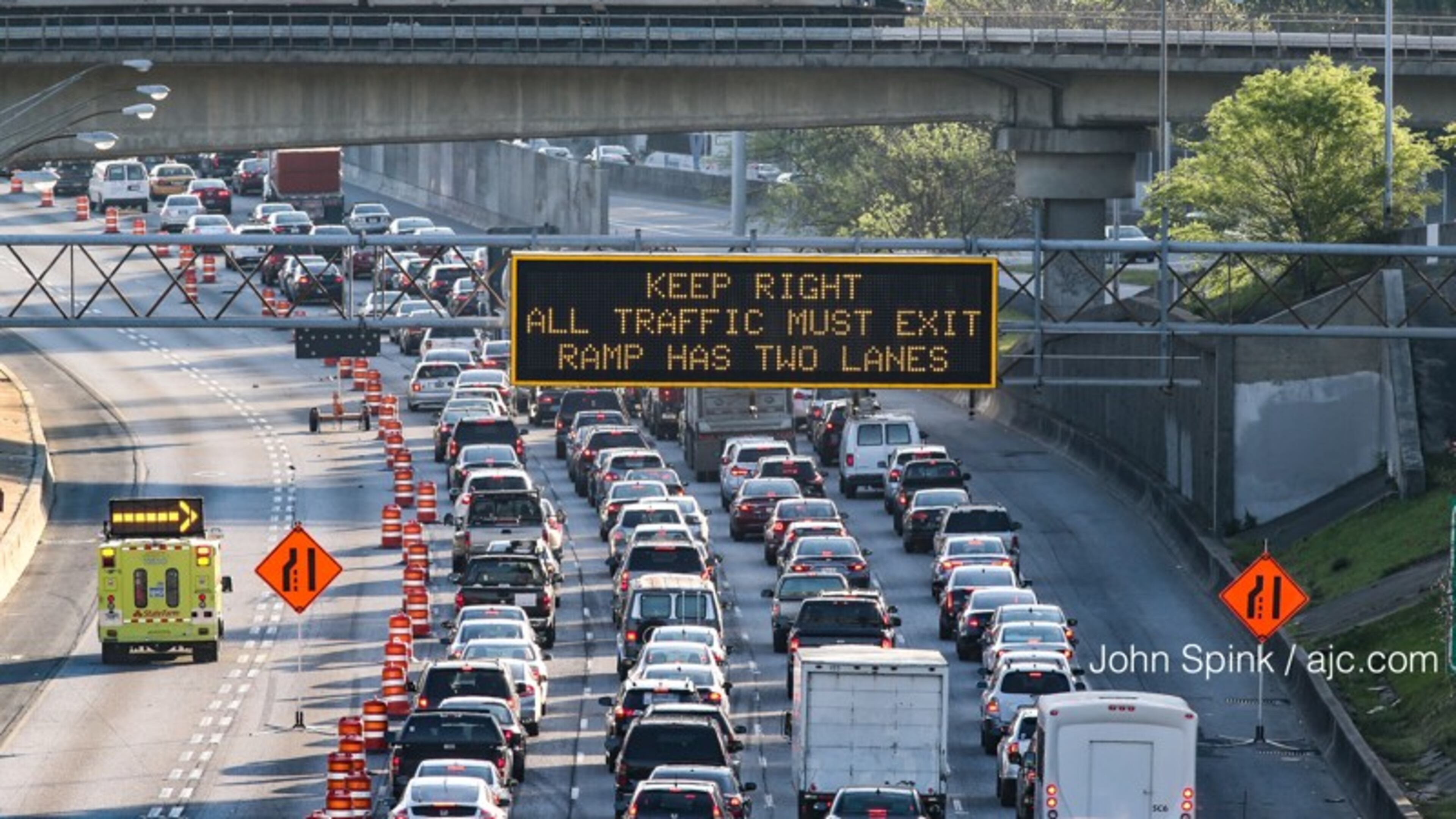 Traffic on I-85 (pictured) and some other area highways was busy but typical for a weekday morning commute, according to the Georgia Department of Transportation. JOHN SPINK/JSPINK@AJC.COM