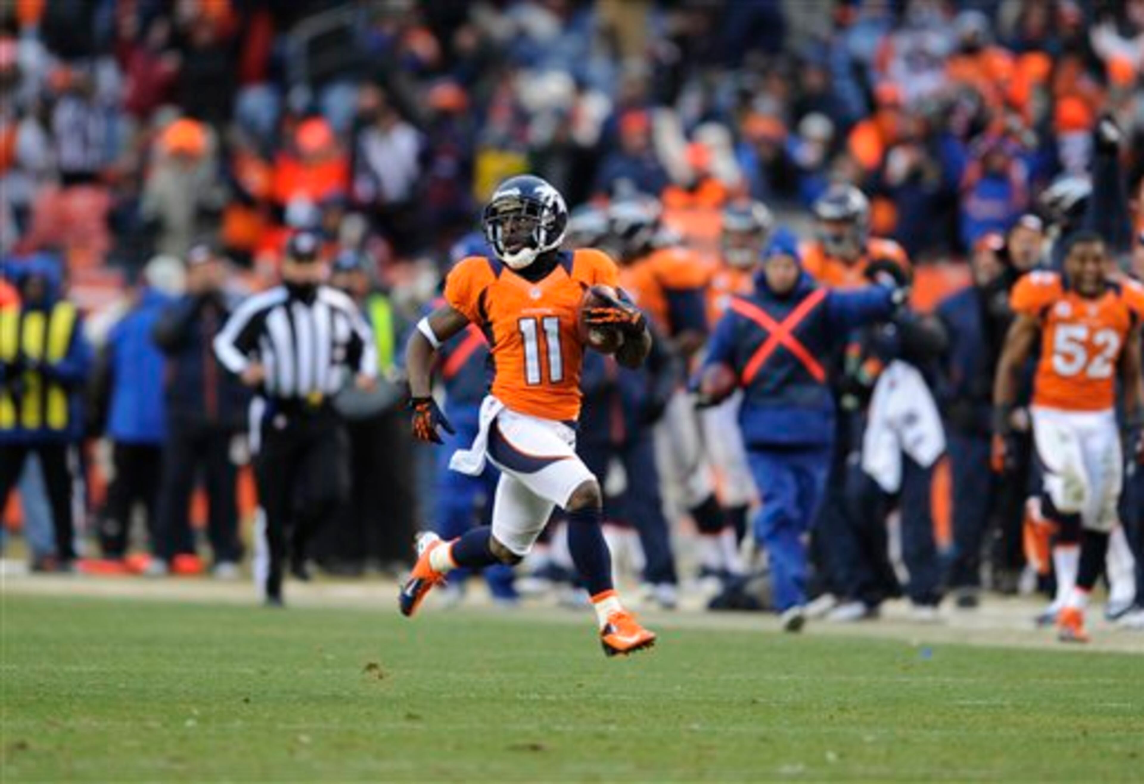 Denver Broncos wide receiver Trindon Holliday runs the opening kickoff of the second half back for a touchdown against the Baltimore Ravens during an AFC divisional playoff NFL football game, Saturday, Jan. 12, 2013, in Denver. (AP Photo/Jack Dempsey)