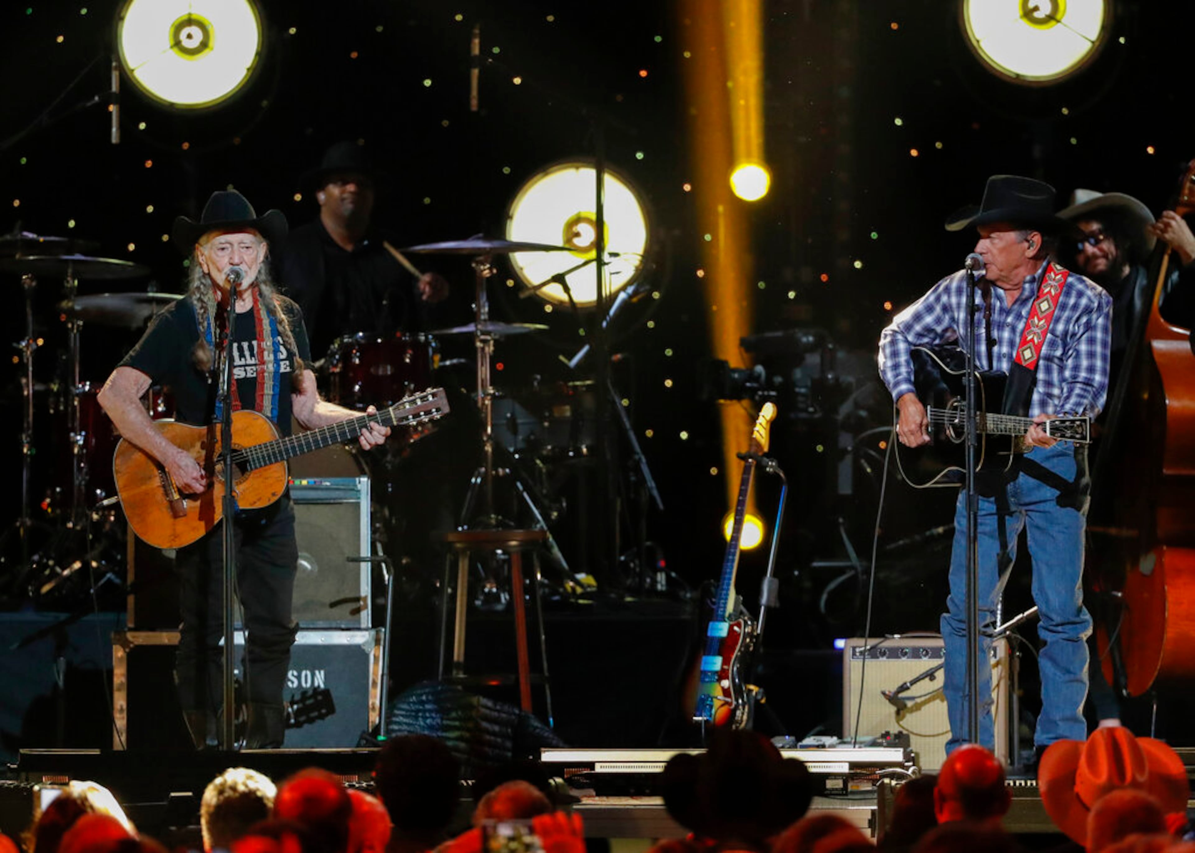 Willie Nelson, left, and George Strait perform at Willie: Life & Songs Of An American Outlaw at Bridgestone Arena on Saturday, Jan. 12, 2019, in Nashville, Tenn. (Photo by Al Wagner/Invision/AP)