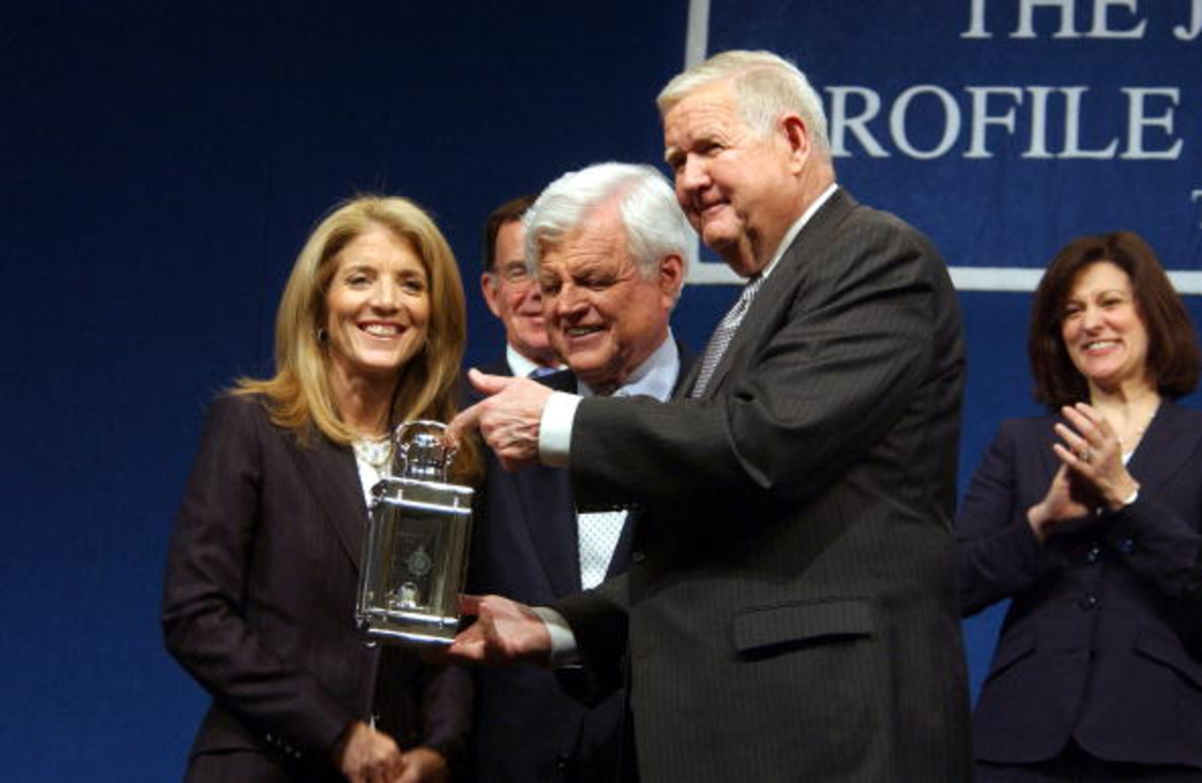 DORCHESTER, MA - MAY 22: Caroline Kennedy and U.S. Senator Ted Kennedy (D-MA) stand with one of the John F. Kennedy Profiles in Courage Award recipients, U.S. Representative John Murtha (D-PA) Center-R) at the JFK Library May 22, 2006 in Dorchester, Massachusetts. In addition to Representative Murtha, former U.S. Navy General Counsel Alberto Mora also received this year's prestigious award. (Photo by Darren McCollester/Getty Images)