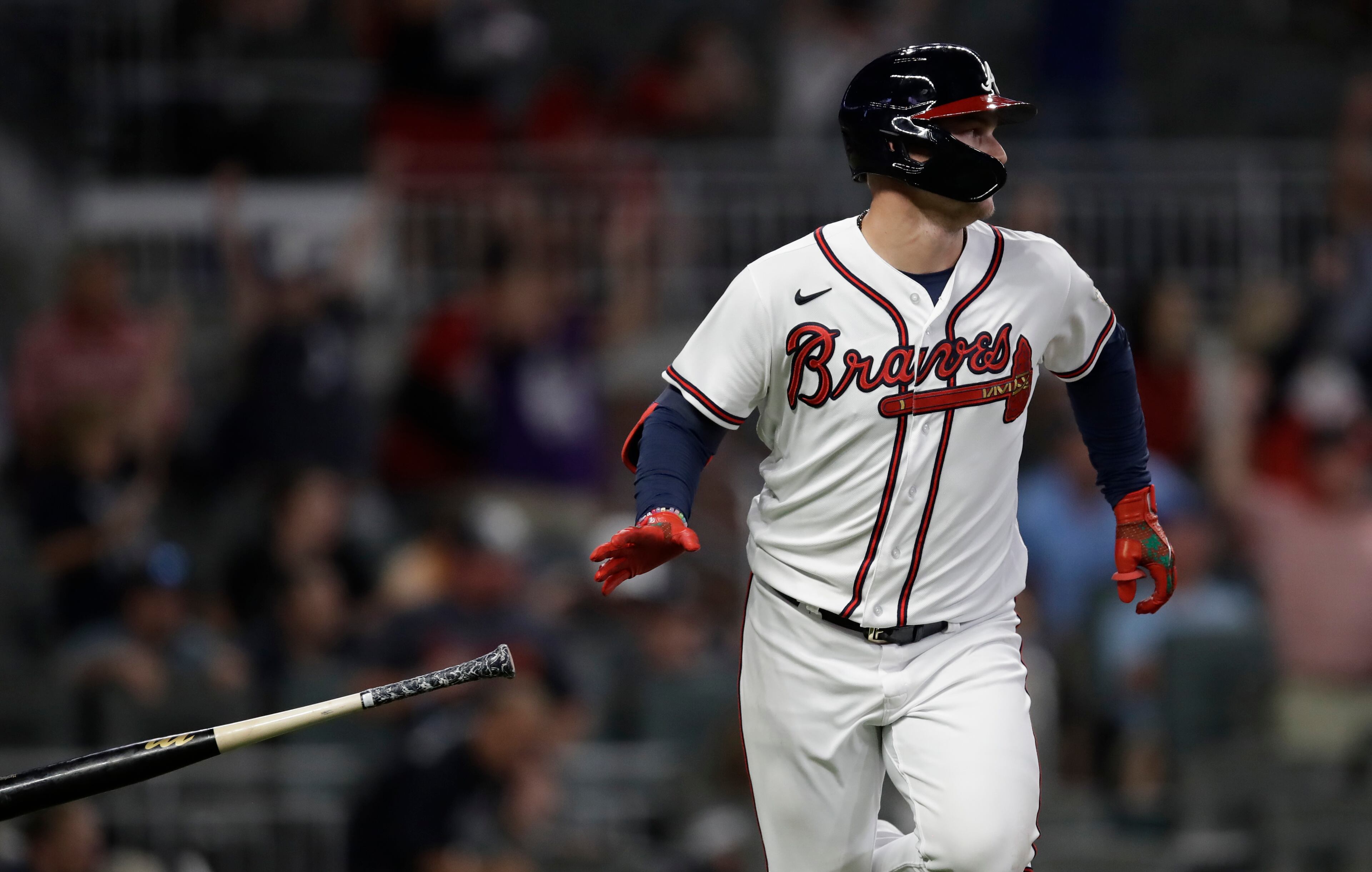 Atlanta Braves' Joc Pederson drops his bat after making the game winning hit against the Washington Nationals in the tenth inning of a baseball game Thursday, Sept. 9, 2021, in Atlanta. (AP Photo/Ben Margot)