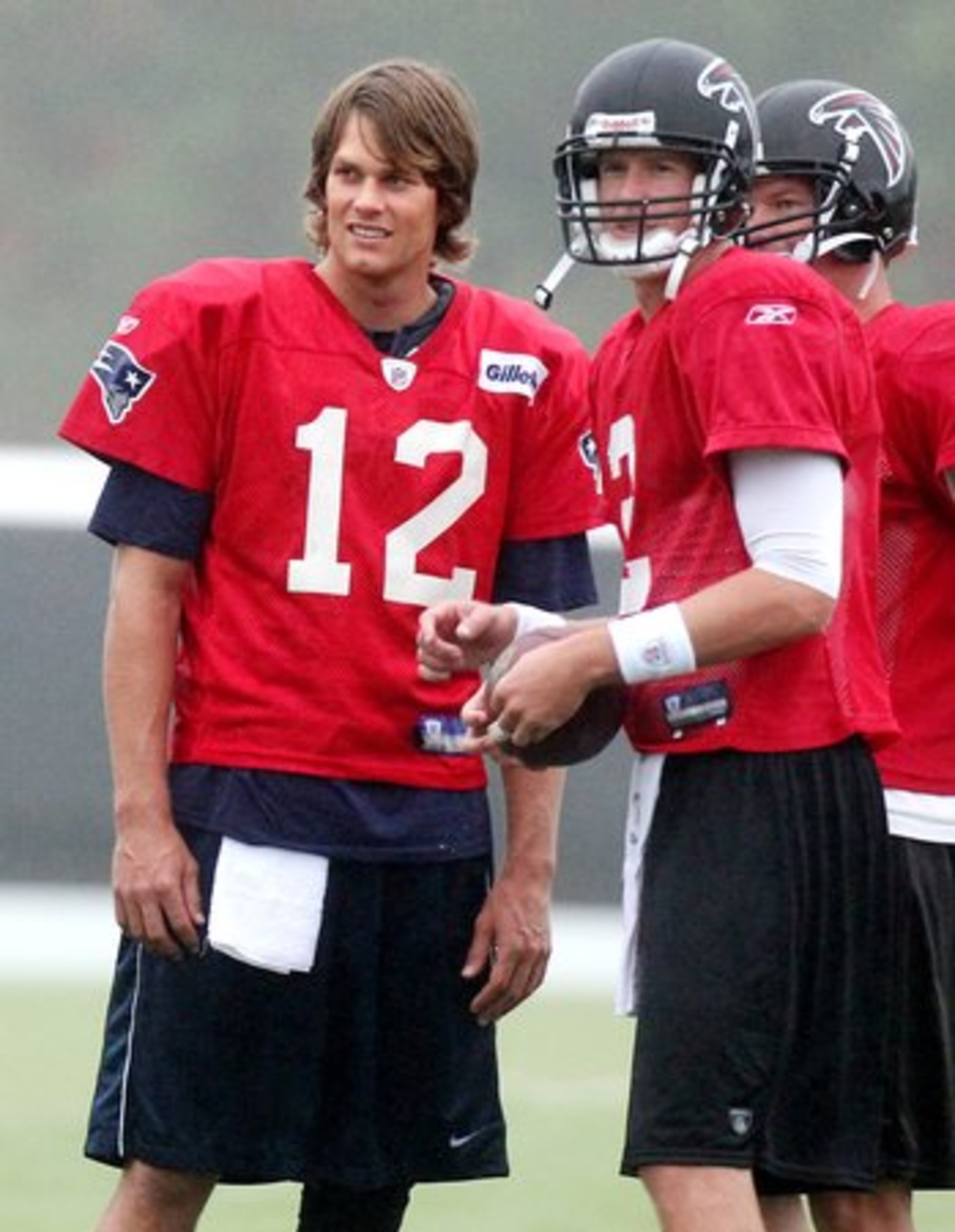 Tom Brady and Matt Ryan share a moment as the Patriots and Falcons had combined practices at the Falcons' practice facility last summer. (Editor's Note: Don't vote on this photo).