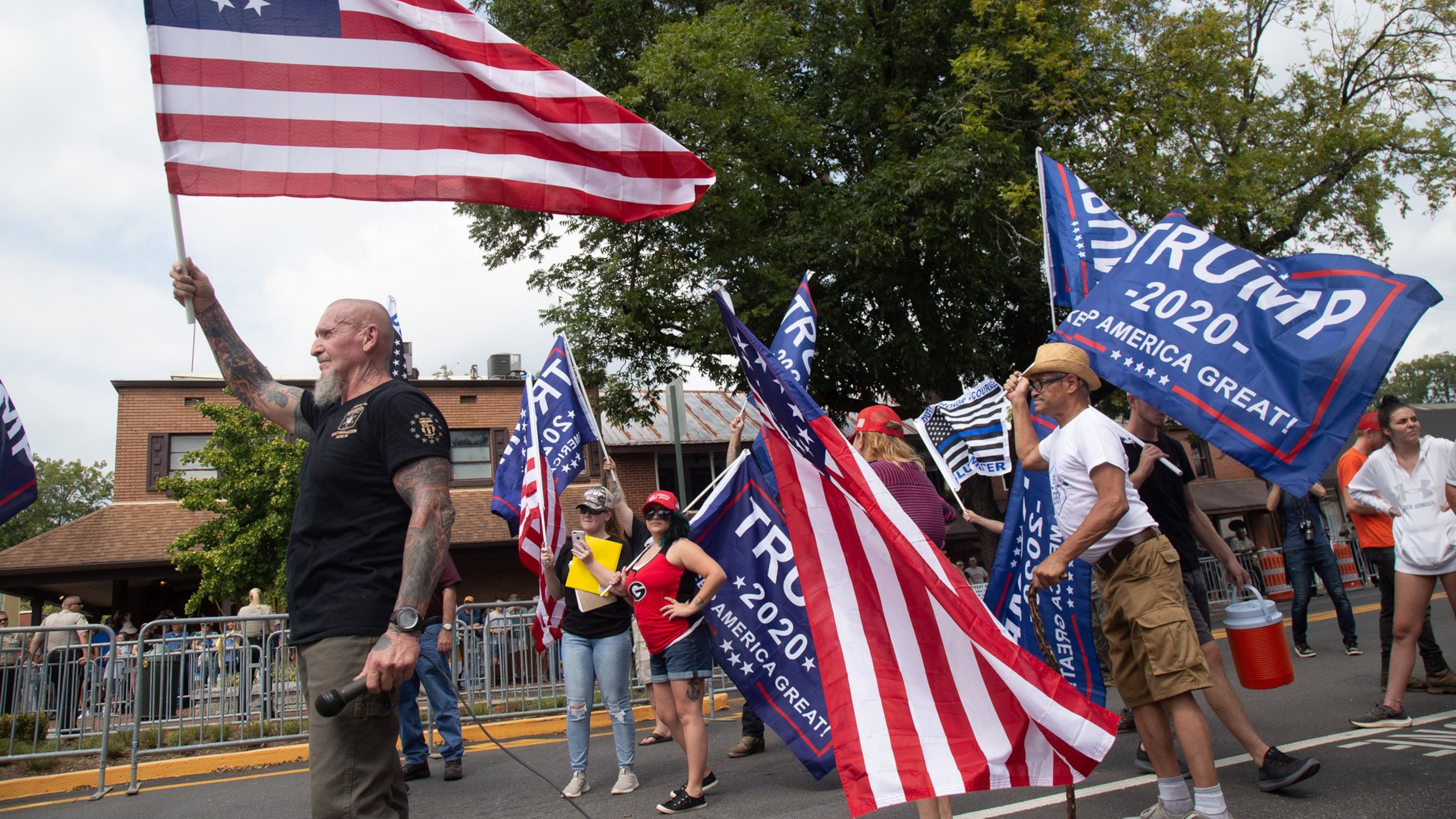 Chester Doles, the principal organizer of Saturday’s pro-Trump rally in Dahlonega, waves a flag at the beginning of the rally September 14, 2019. Republicans distanced themselves from the event that attracted white nationalists and supremacists. (Photo by STEVE SCHAEFER / SPECIAL TO THE AJC)