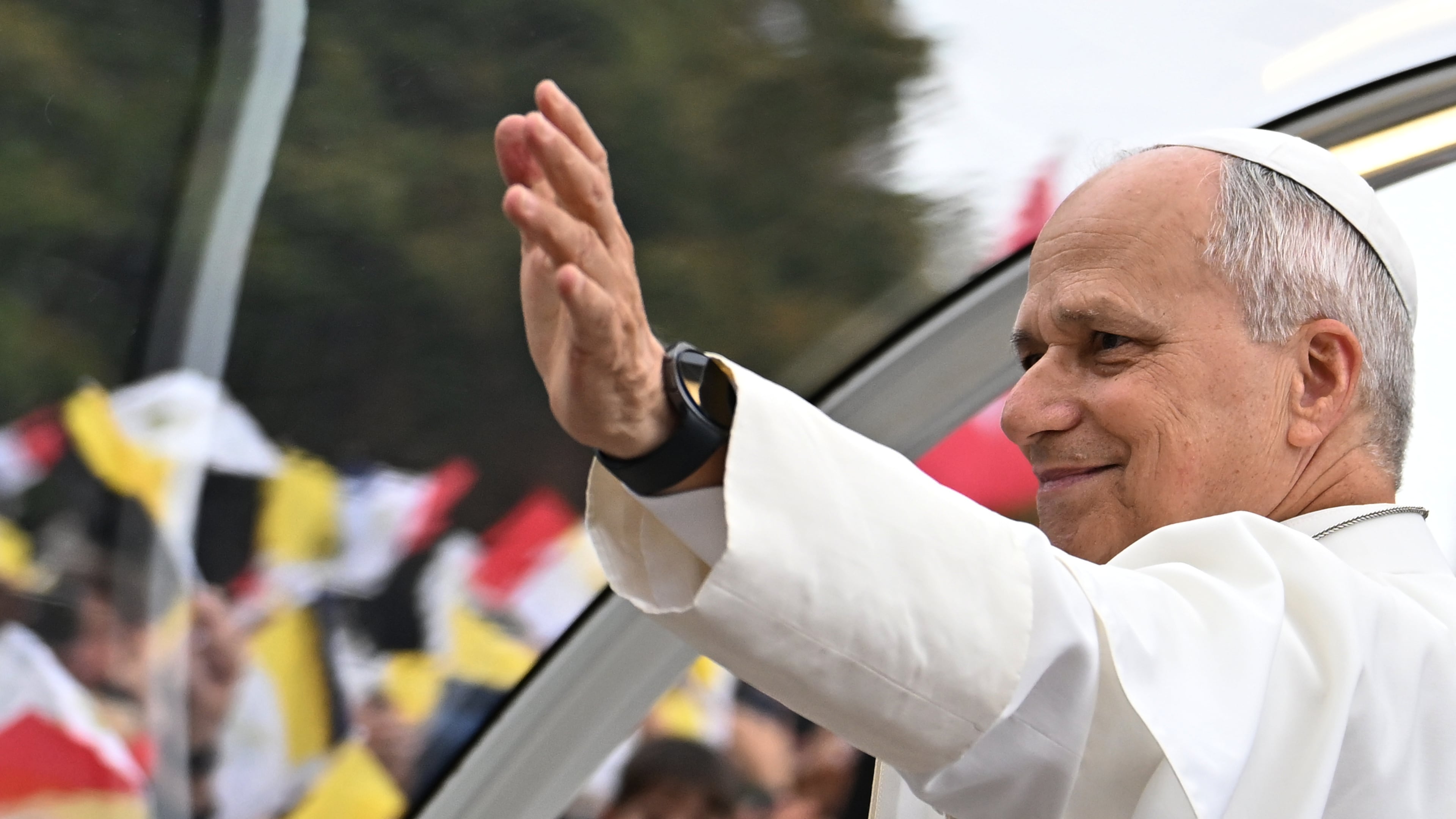 Pope Leo XIV waves to the crowd on the Champs Elysees avenue before a mass at the Place de la Concorde in Paris, Saturday, Sept. 26, 2026. (AP Photo/Emma Da Silva)