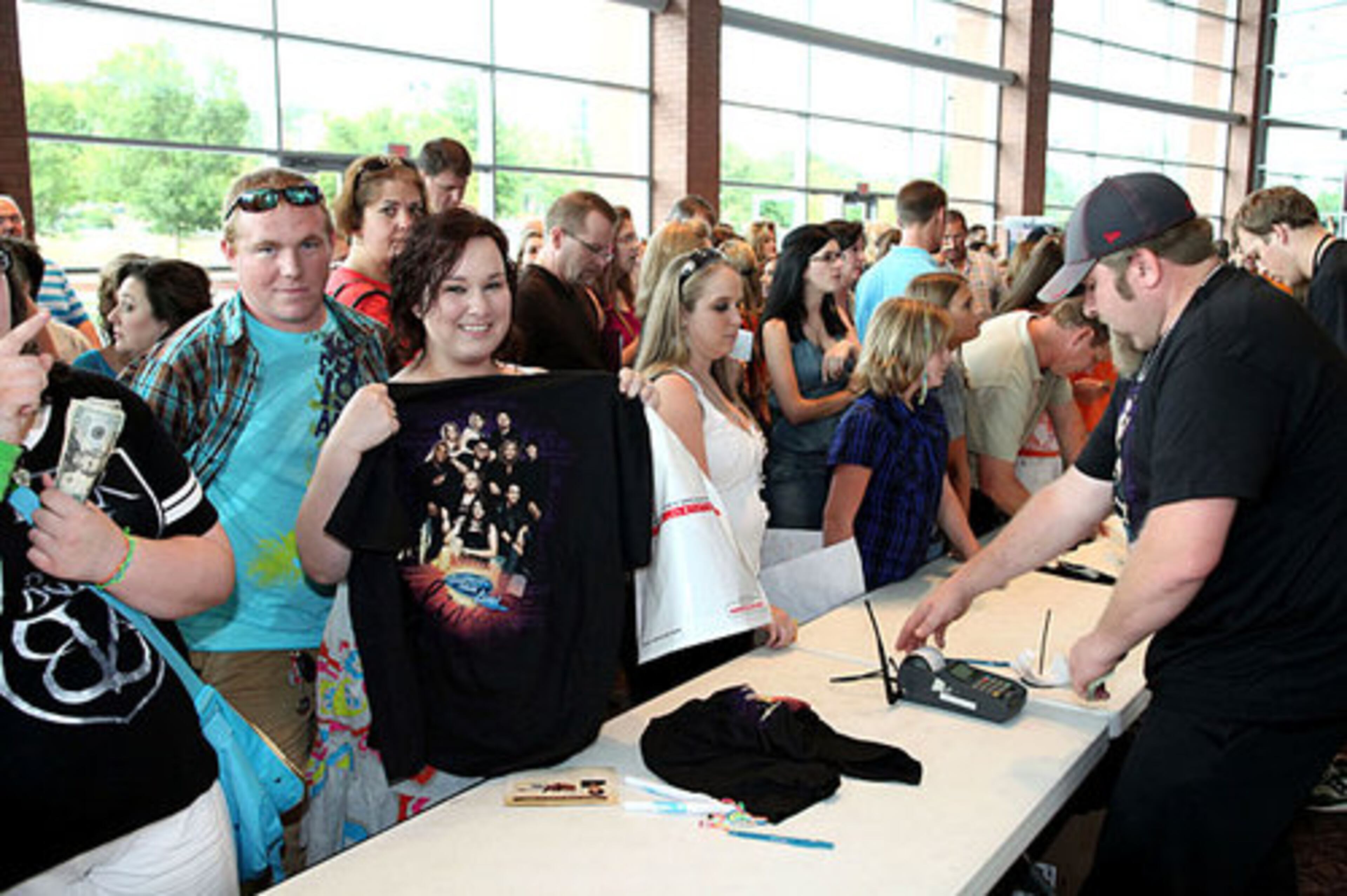 Bailey Daigle is buying Idols merchandise to take back to Athens.