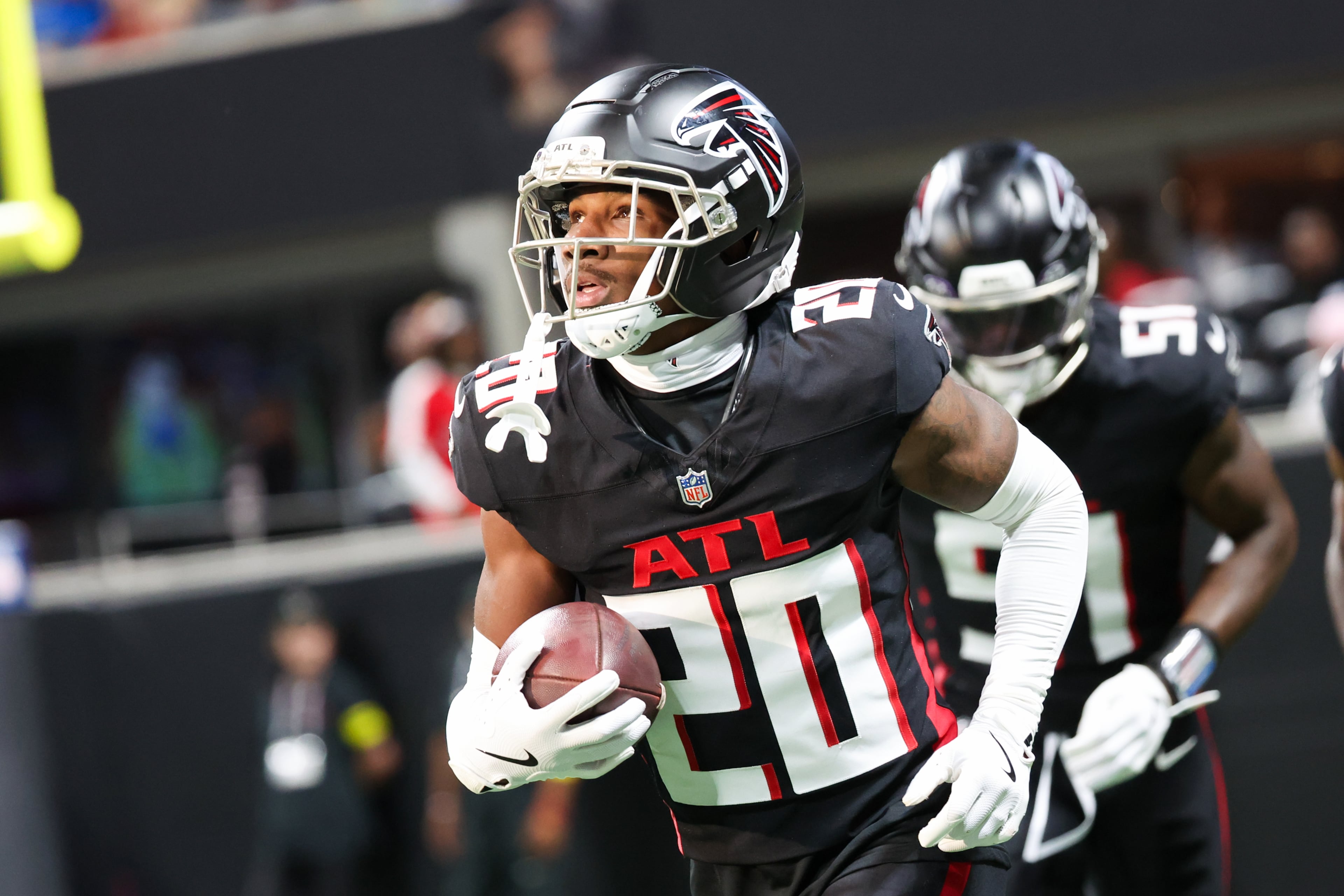 Atlanta Falcons cornerback Dee Alford (20) runs the ball during the first half of an NFL preseason game against the Detroit Lions at Mercedes-Benz Stadium in Atlanta on Friday, August 8, 2025. (Arvin Temkar / AJC)