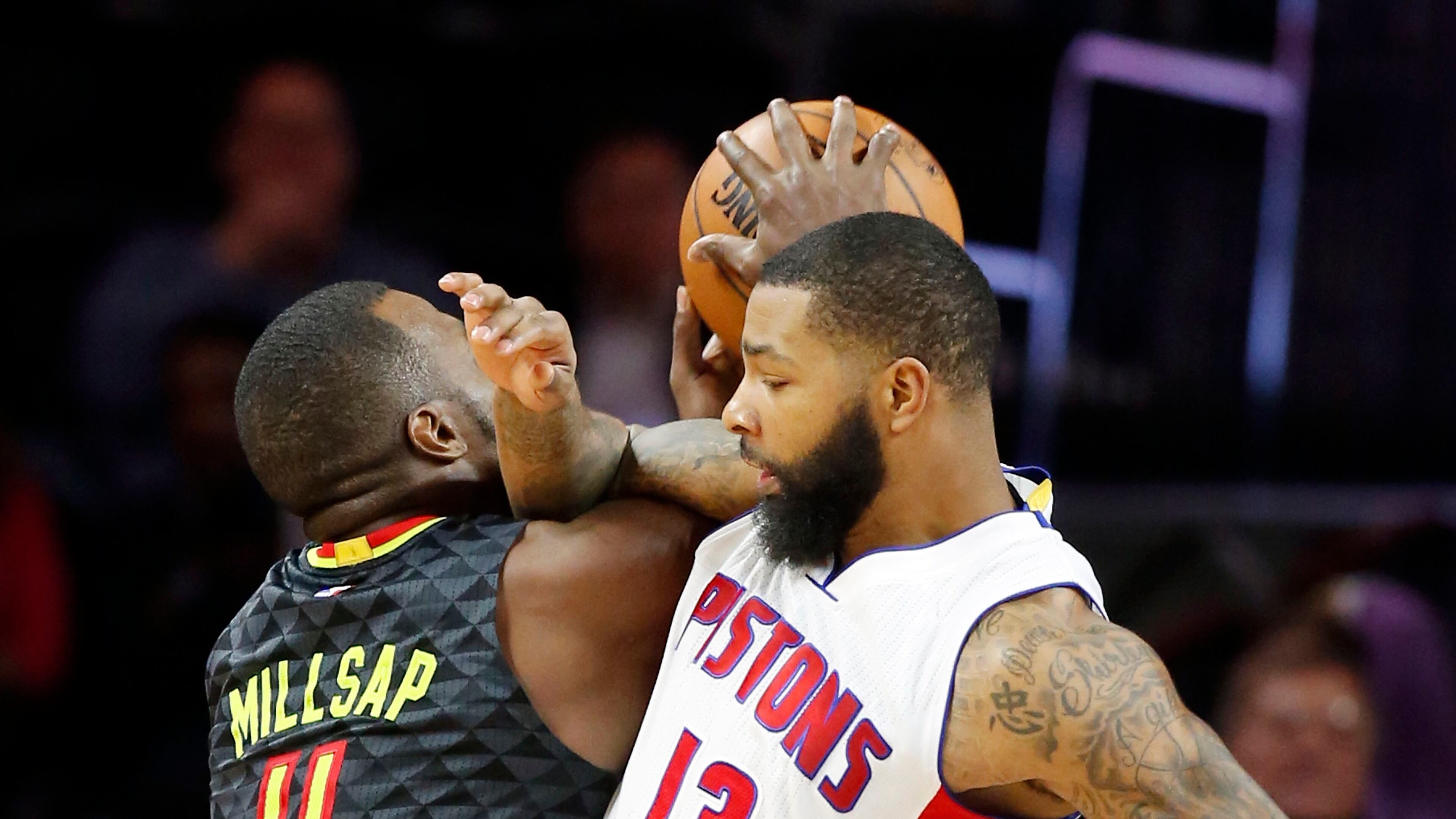 Atlanta Hawks forward Paul Millsap (4) is fouled by Detroit Pistons forward Marcus Morris (13) during the second half of an NBA basketball game, Wednesday, Jan. 18, 2017, in Auburn Hills, Mich. (AP Photo/Carlos Osorio)