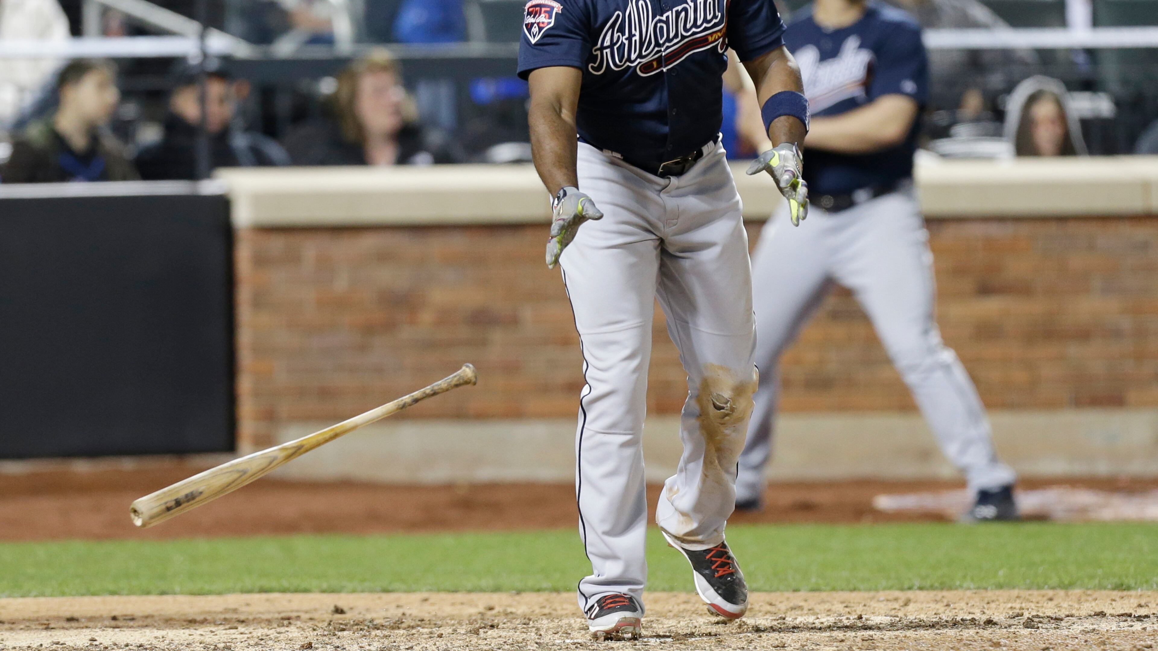Justin Upton watches his three-run home in the top of the ninth inning. The Braves would need the insurance runs as the Mets rallied in the bottom of the ninth. (AP Photo/Frank Franklin II)