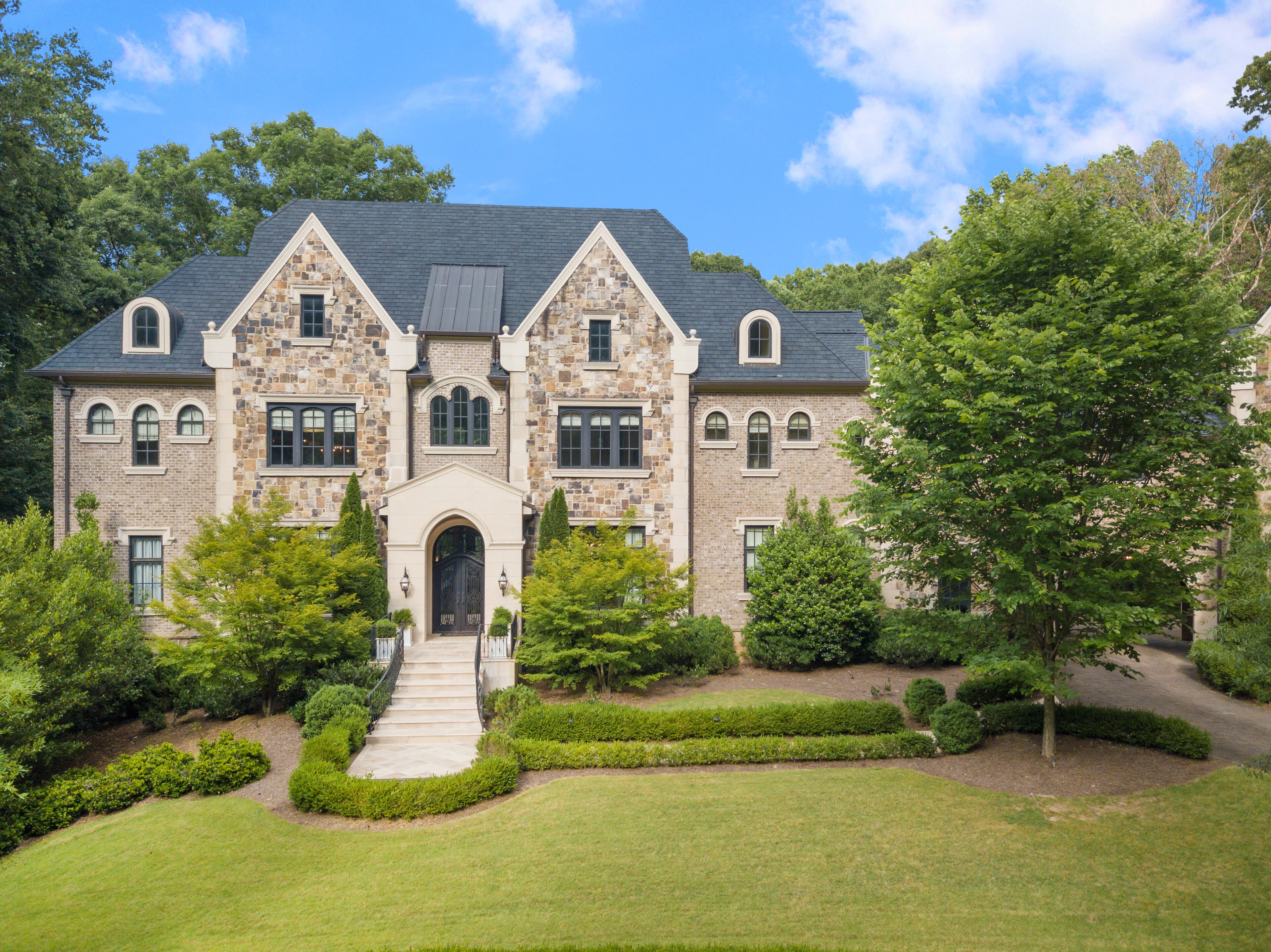 Spectacular custom English Manor home in coveted Winterthur Estates. Text by Coldwell Banker Real Estate