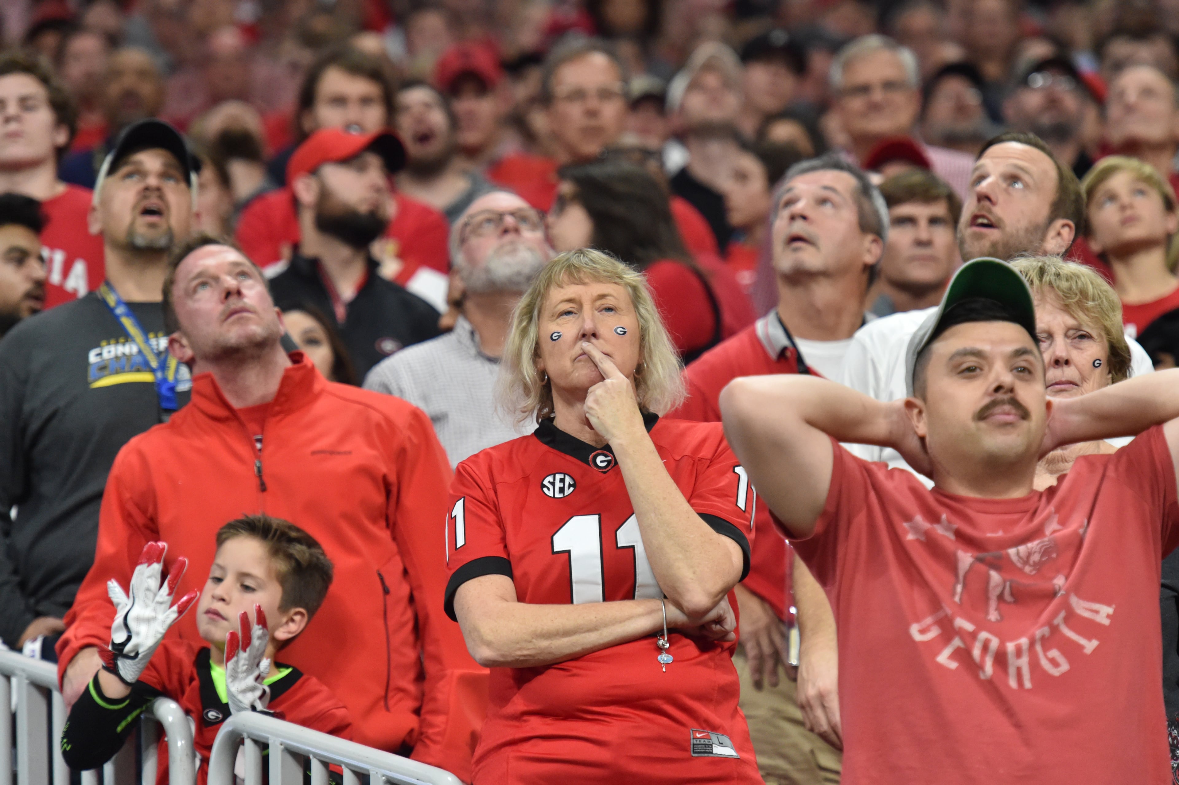 December 1, 2018 Atlanta - Georgia fans react at the end of the 4th quarter of the SEC Football Championship at Mercedes-Benz Stadium on Saturday, December 1, 2018. Alabama won 35-28 over the Georgia. HYOSUB SHIN / HSHIN@AJC.COM