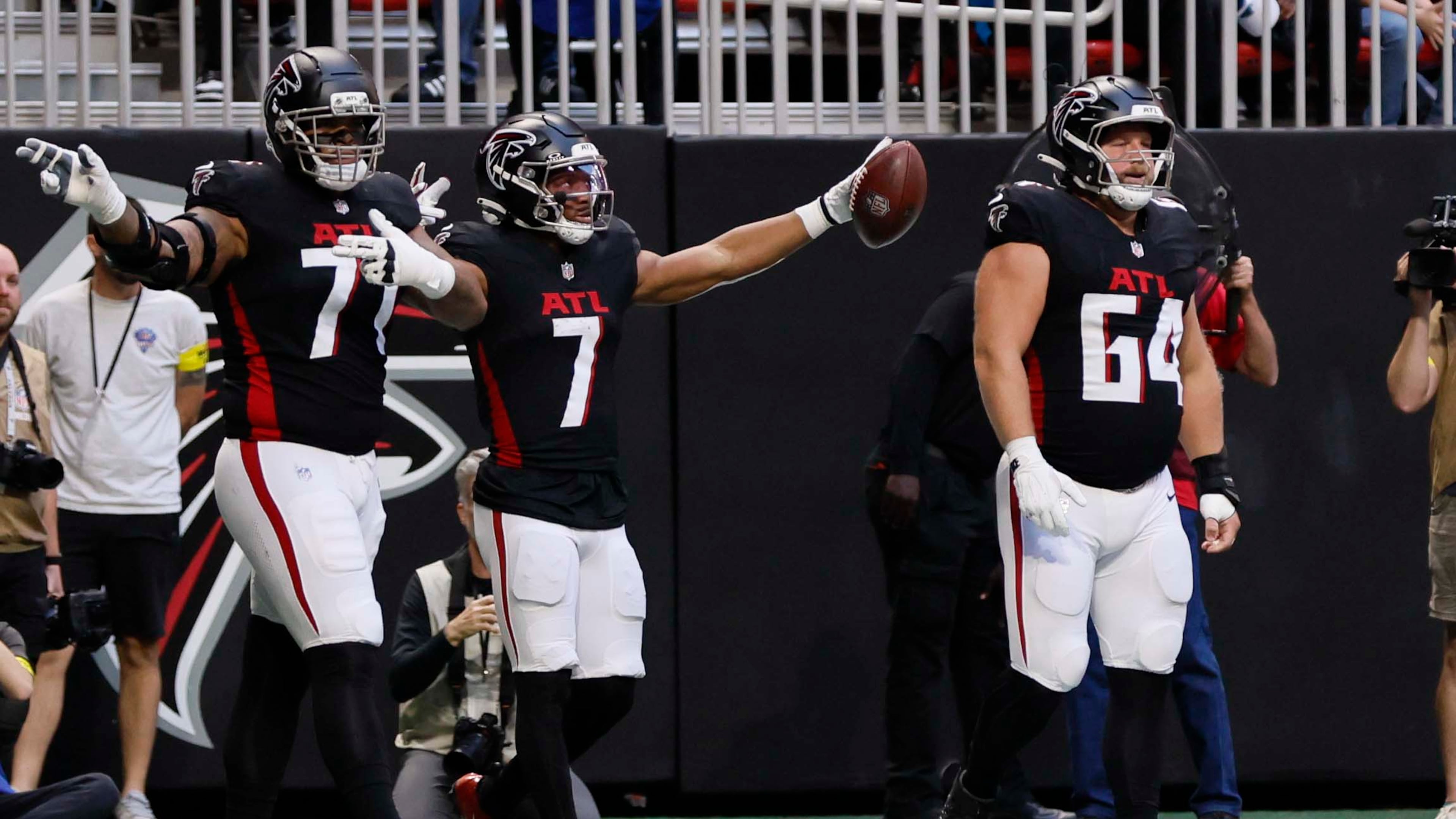 Falcons running back Bijan Robinson (center) reacts after a first down during against the Carolina Panthers at Mercedes-Benz Stadium on Sunday, Nov. 16, 2025. (Miguel Martinez/AJC)