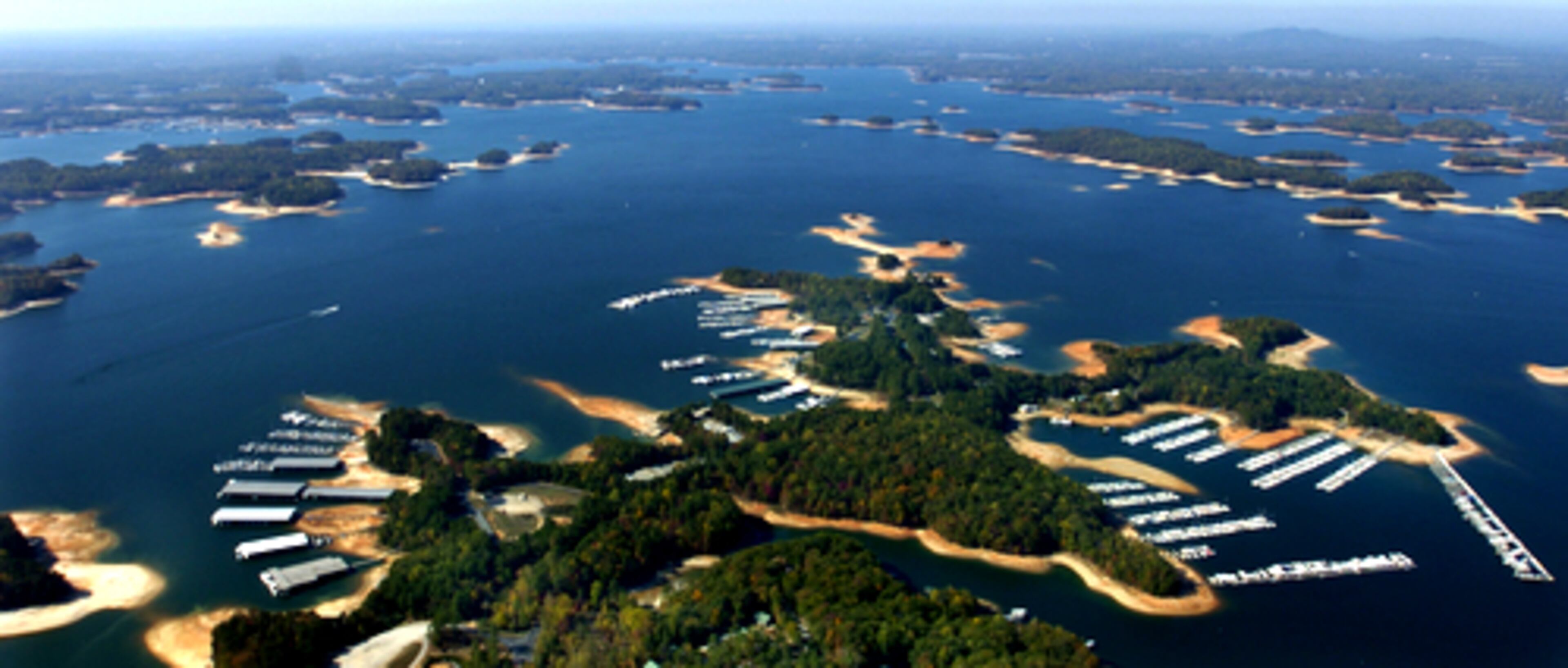 These boat docks are still in deep enough water but the ongoing effects of the state's historic drought can be seen in the expanding shoreline.
