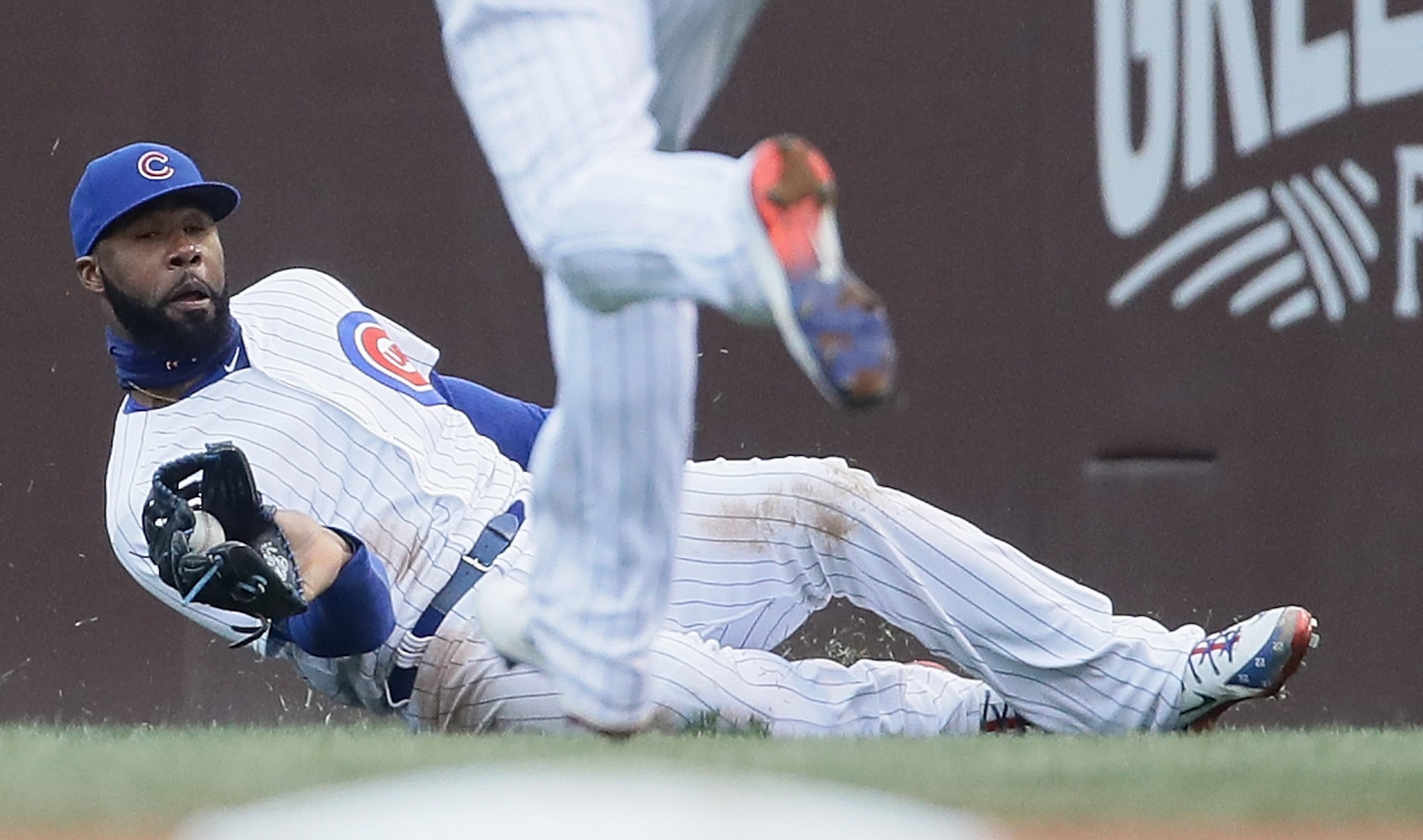 CHICAGO, IL - APRIL 13: Jason Heyward #22 of the Chicago Cubs makes a sliding catch in the 7th inning against thre Atlanta Braves at Wrigley Field on April 13, 2018 in Chicago, Illinois. The Braves defeated the Cubs 4-0. (Photo by Jonathan Daniel/Getty Images)