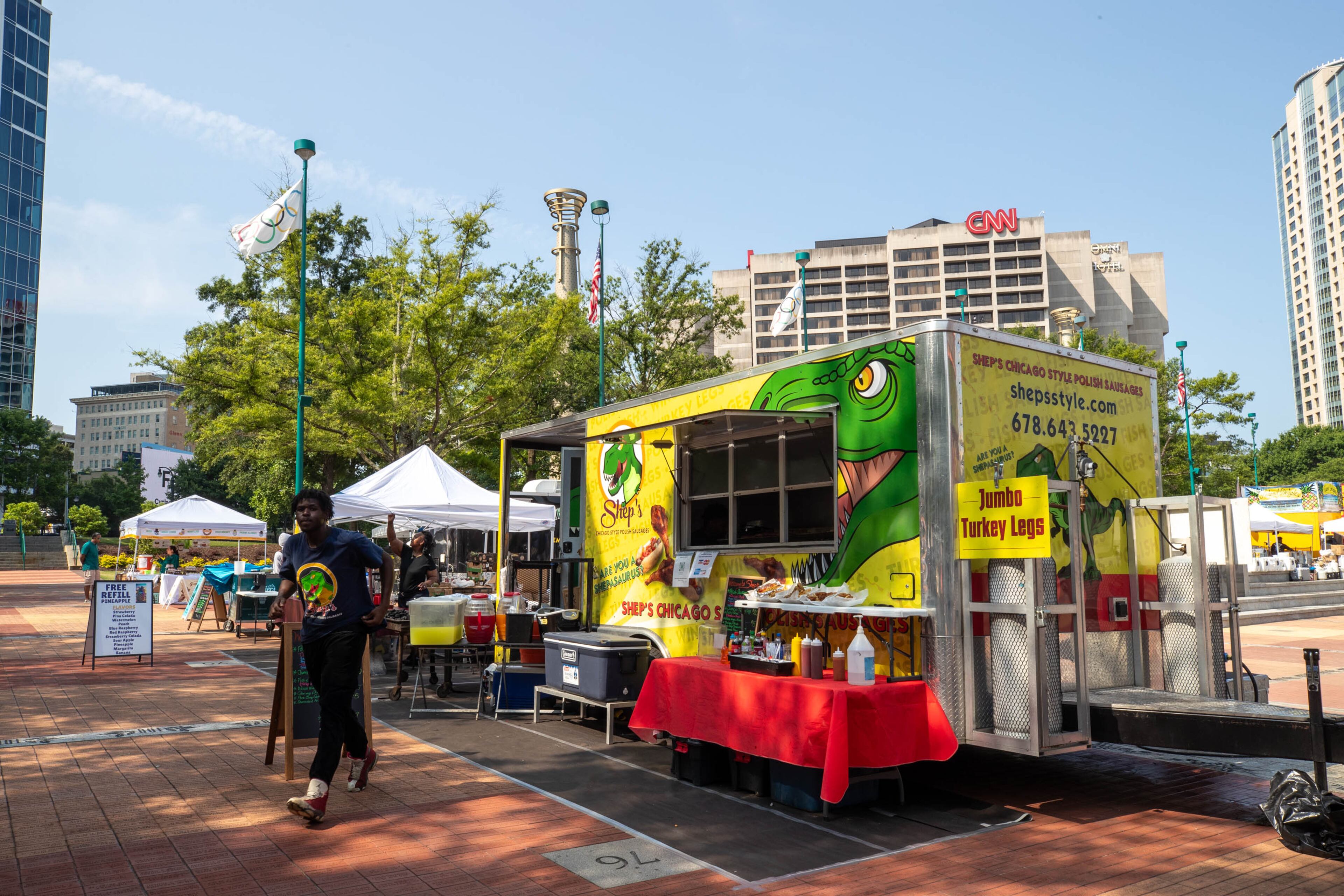 A worker at the Shep’s Style food truck at the Juneteenth Parade and Music Festival in Atlanta on Saturday, June 17, 2023. (Katelyn Myrick/katelyn.myrick@ajc.com)