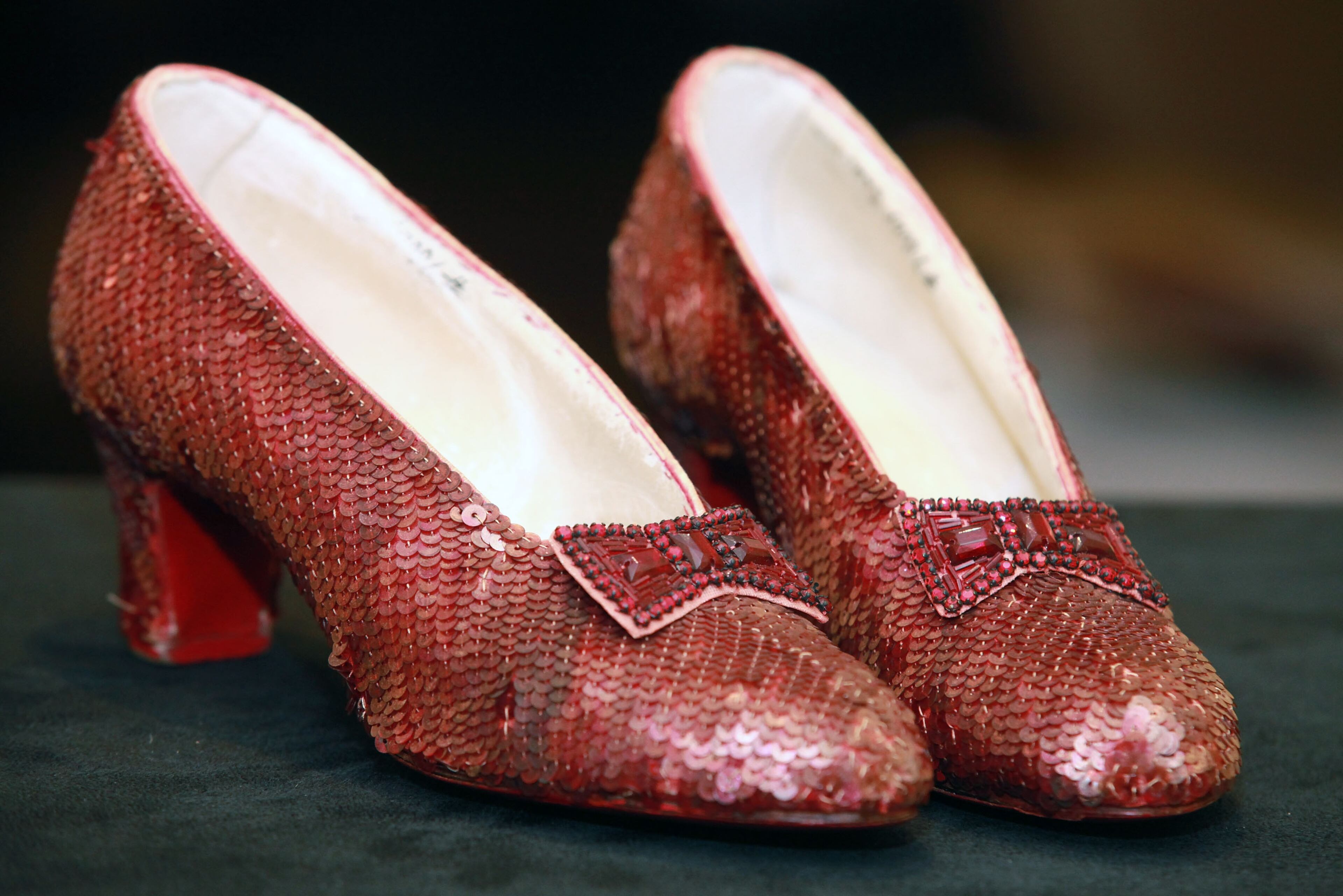NEW YORK, NY - DECEMBER 05: "The Wizard of Oz" Ruby Red Slippers worn by Judy Garland in 1939 are displayed at a viewing at the Plaza Athenee on December 5, 2011 in New York City. "The Wizard of Oz" Ruby Red slippers are a women's size 5 and appraised at $3 million dollars. (Photo by Astrid Stawiarz/Getty Images)