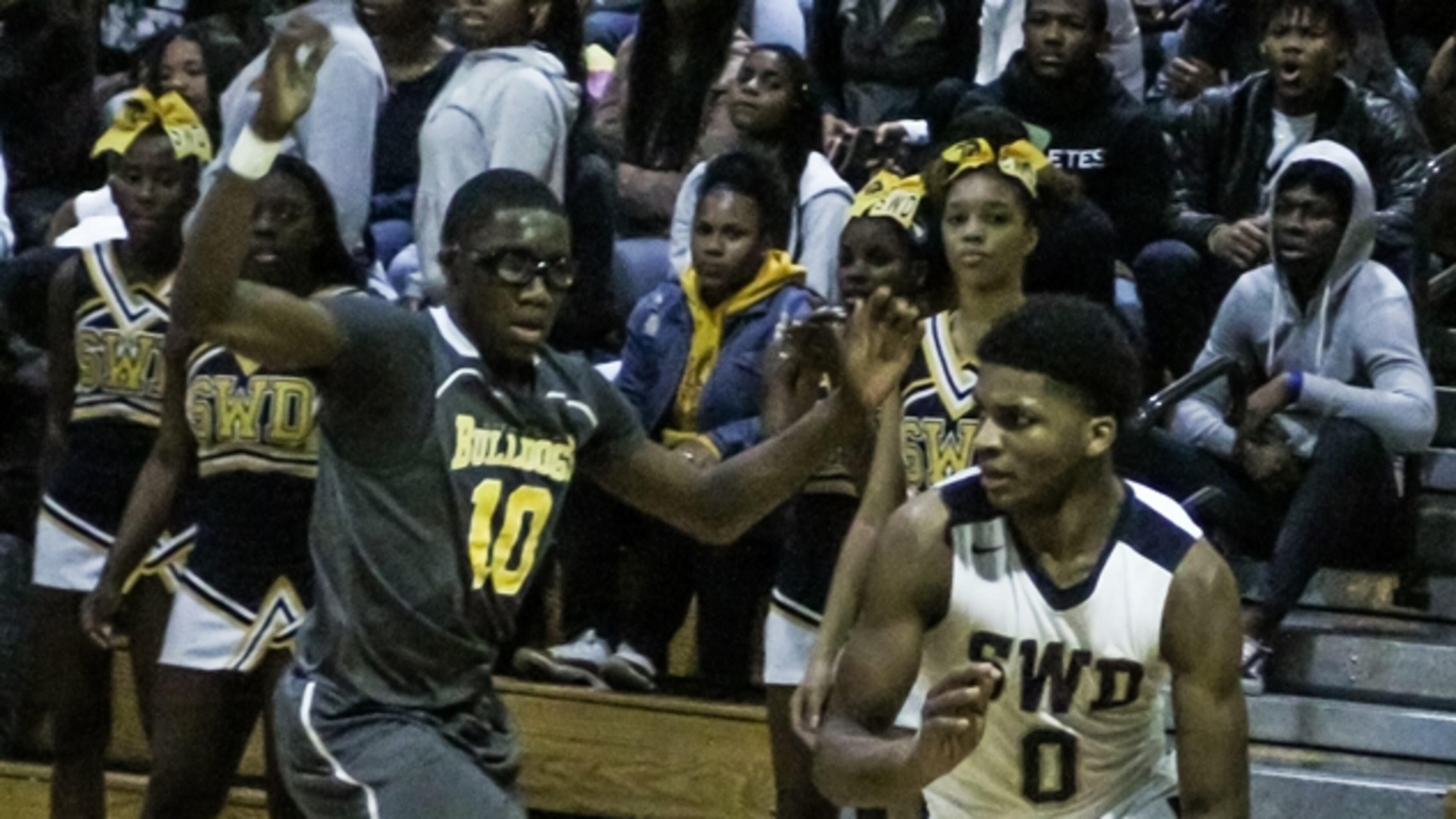 Lithonia’s Brison Rockcliffe guards SW DeKalb’s KD Johnson.