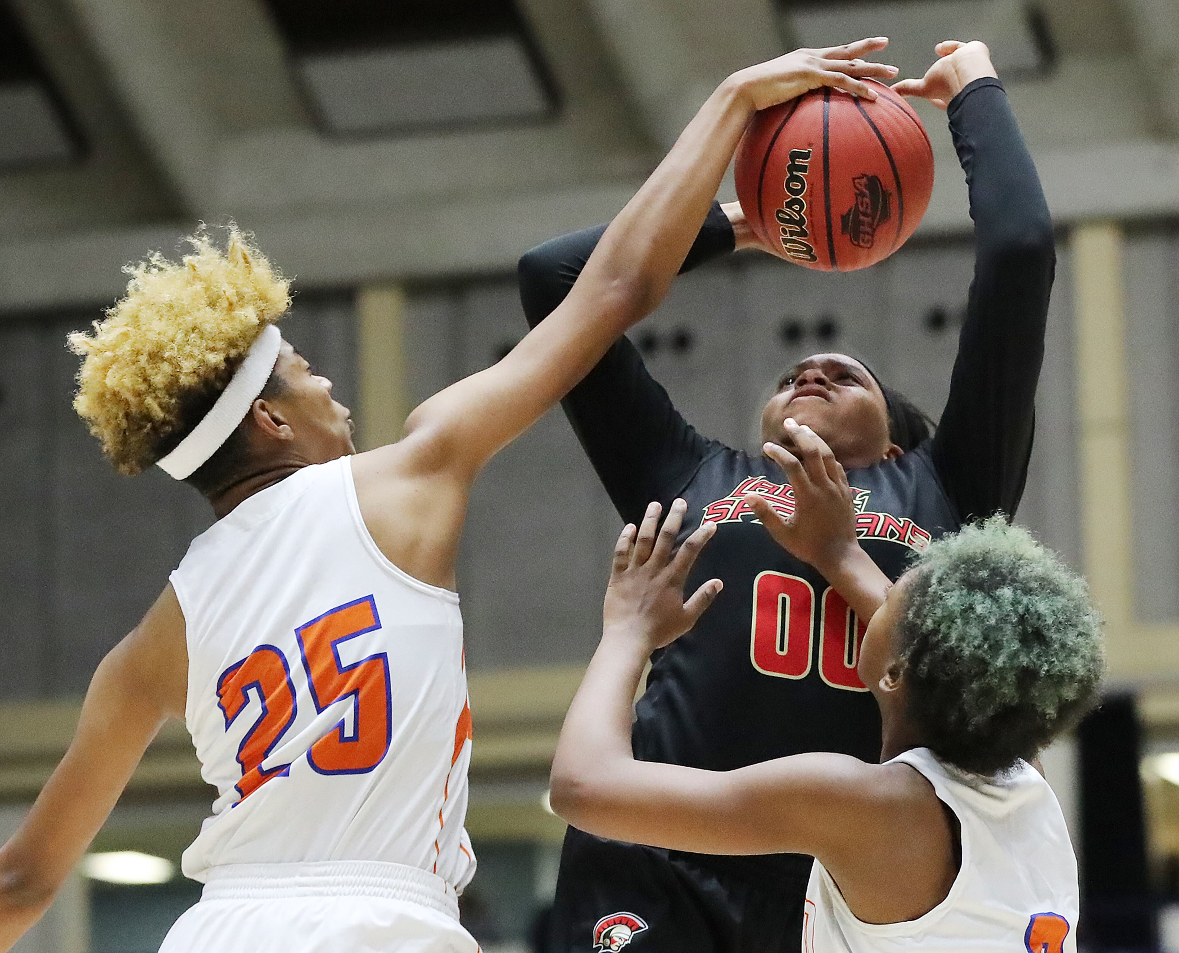 March 8, 2018 Macon: GAC's Caria Reynolds is fouled by Johnson-Savannah center Giana Copeland as she tries to get off a shot in their GHSA state basketball championship game on Thursday, March 8, 2018, in Macon. Curtis Compton/ccompton@ajc.com
