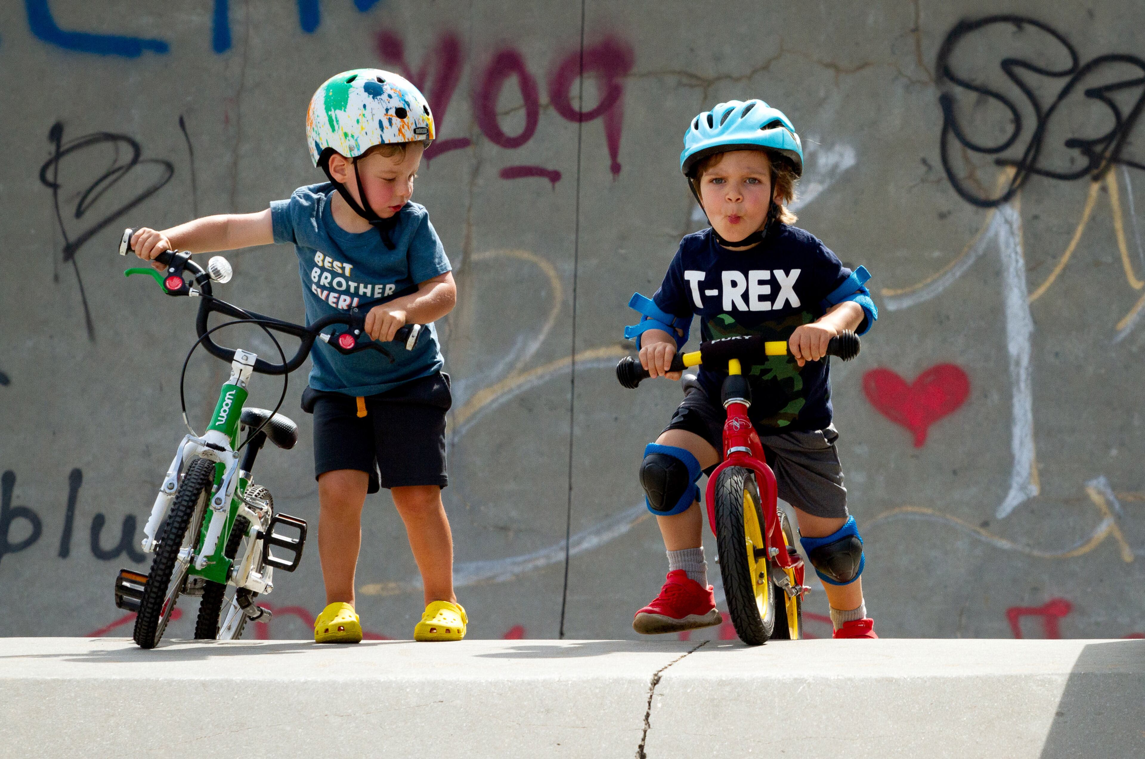 Oliver Weber, 3, (R) gets ready to ride his bike down one of the ramps at the Historic Fourth Ward Skatepark on Sunday, July 12, 2020. STEVE SCHAEFER FOR THE ATLANTA JOURNAL-CONSTITUTION
