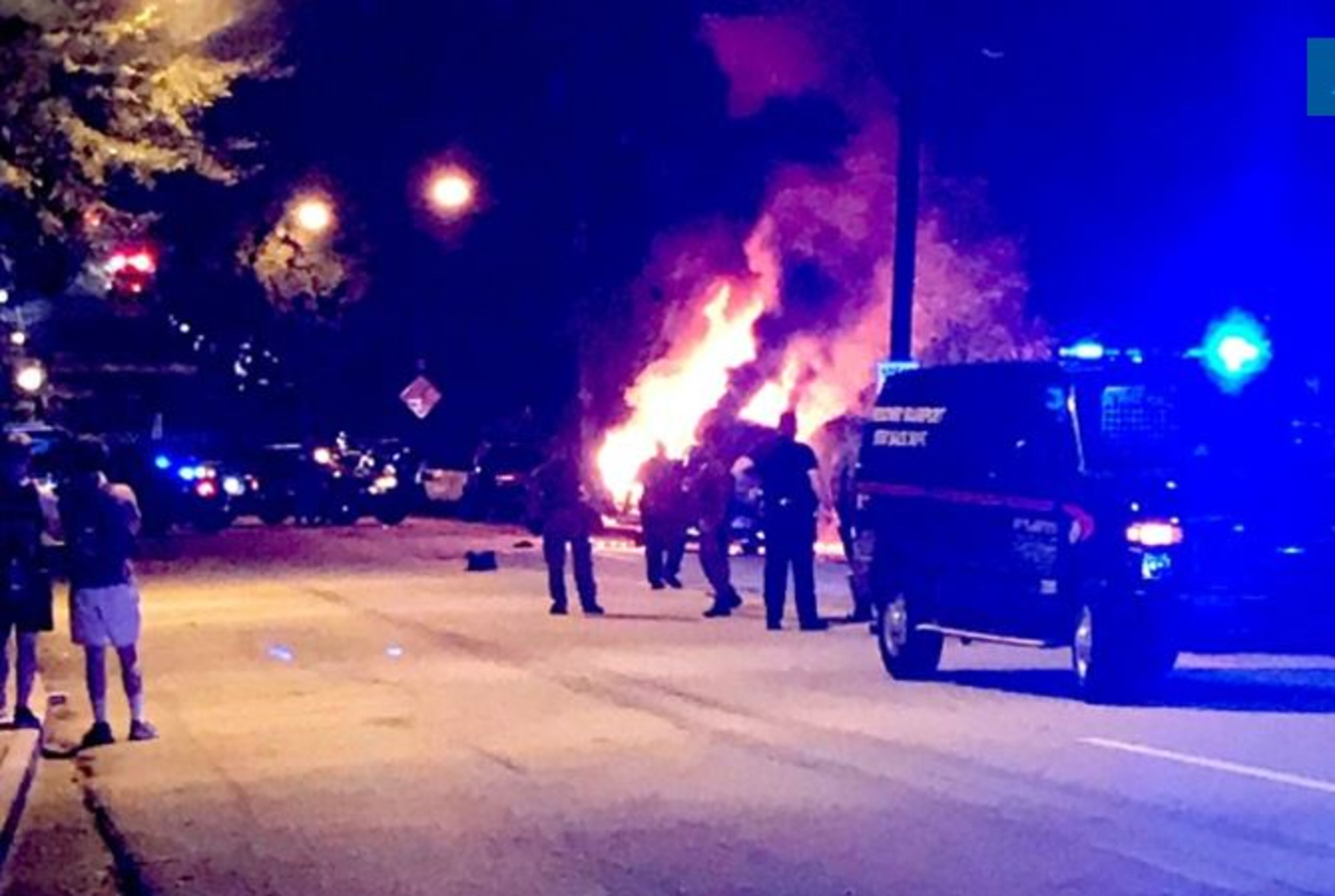 A police car is set afire near the Georgia Tech police station Monday night. Photo: Nelson Helm/AJC