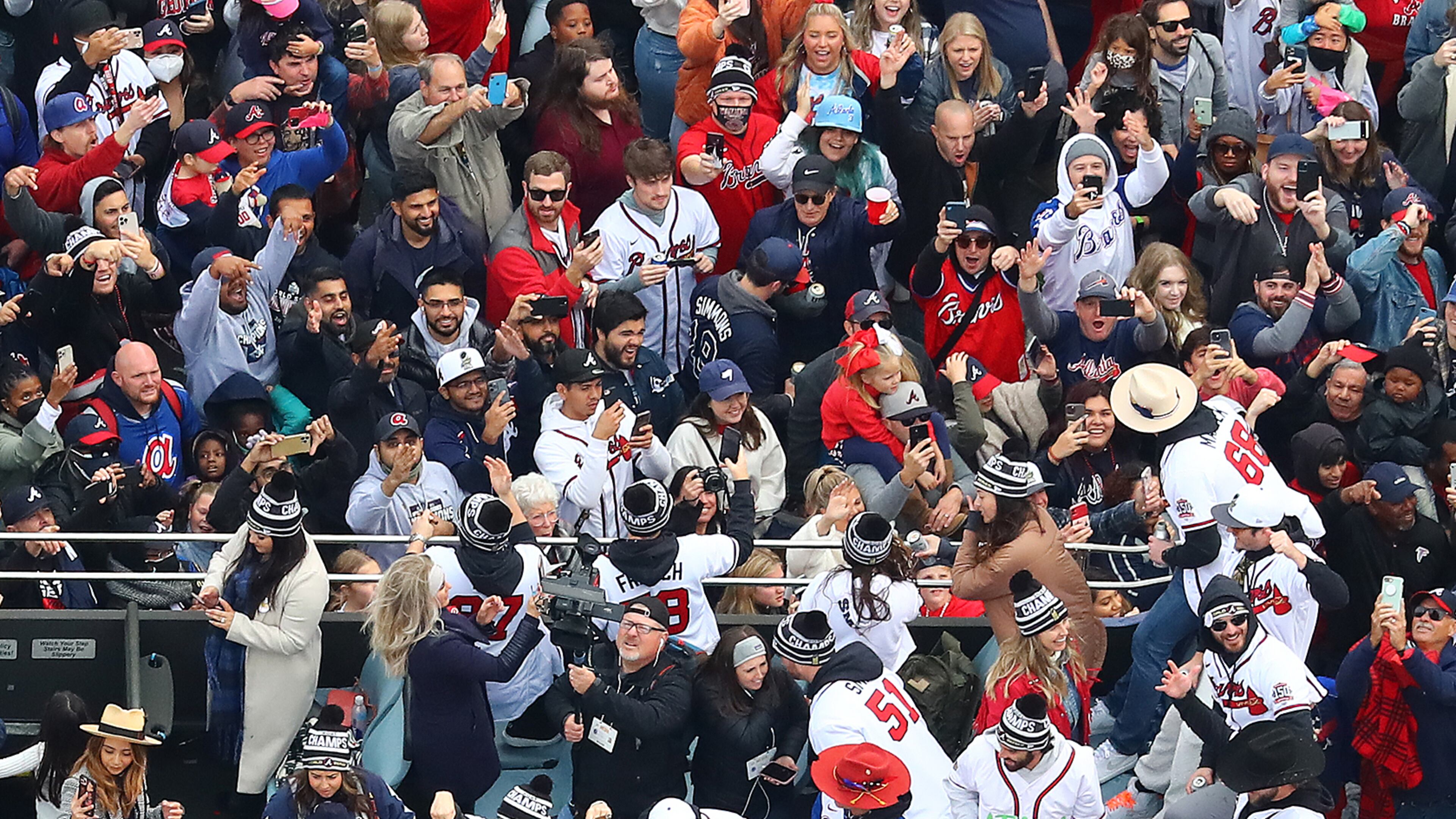 110521 ATLANTA: Players party with fans from the top of a double decker bus arriving in the Battery as the Atlanta Braves host a World Series Championship Parade and celebration on Friday, Nov. 5, 2021, in Atlanta. “Curtis Compton / Curtis.Compton@ajc.com”